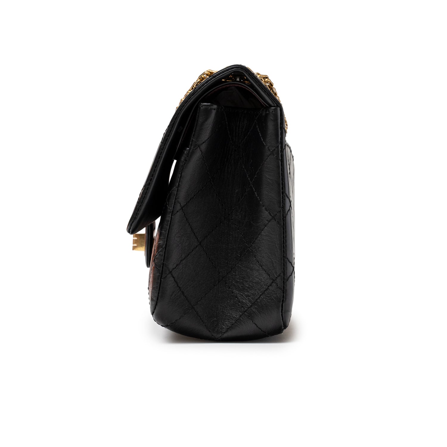 Side view of Chanel 2.55 Reissue 226 Flap Black Aged Calfskin Brushed Gold Hardware handbag showing quilted leather texture