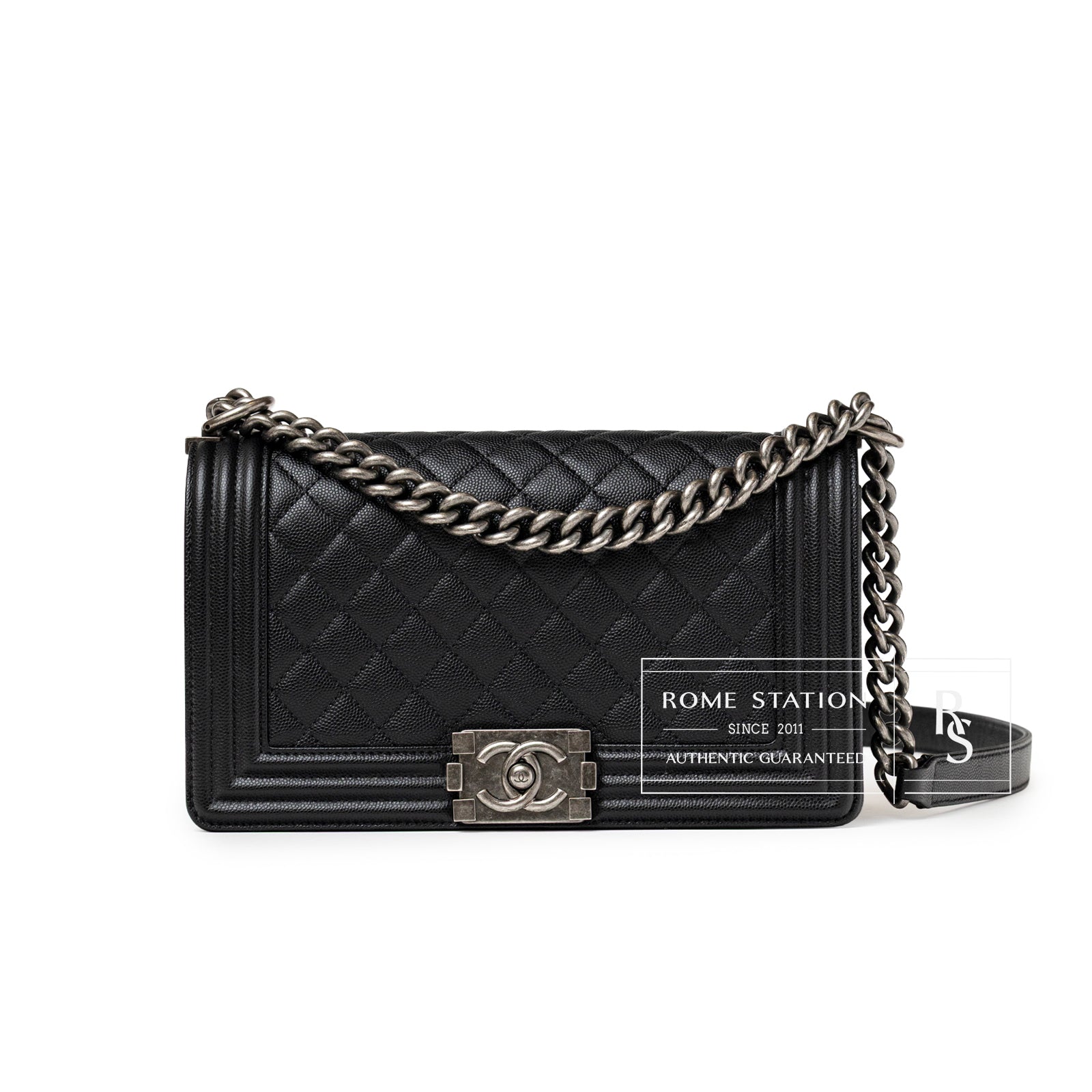 Front view of Chanel Boy Bag Medium Black Caviar Aged Ruthenium Hardware with chain strap and quilted texture.