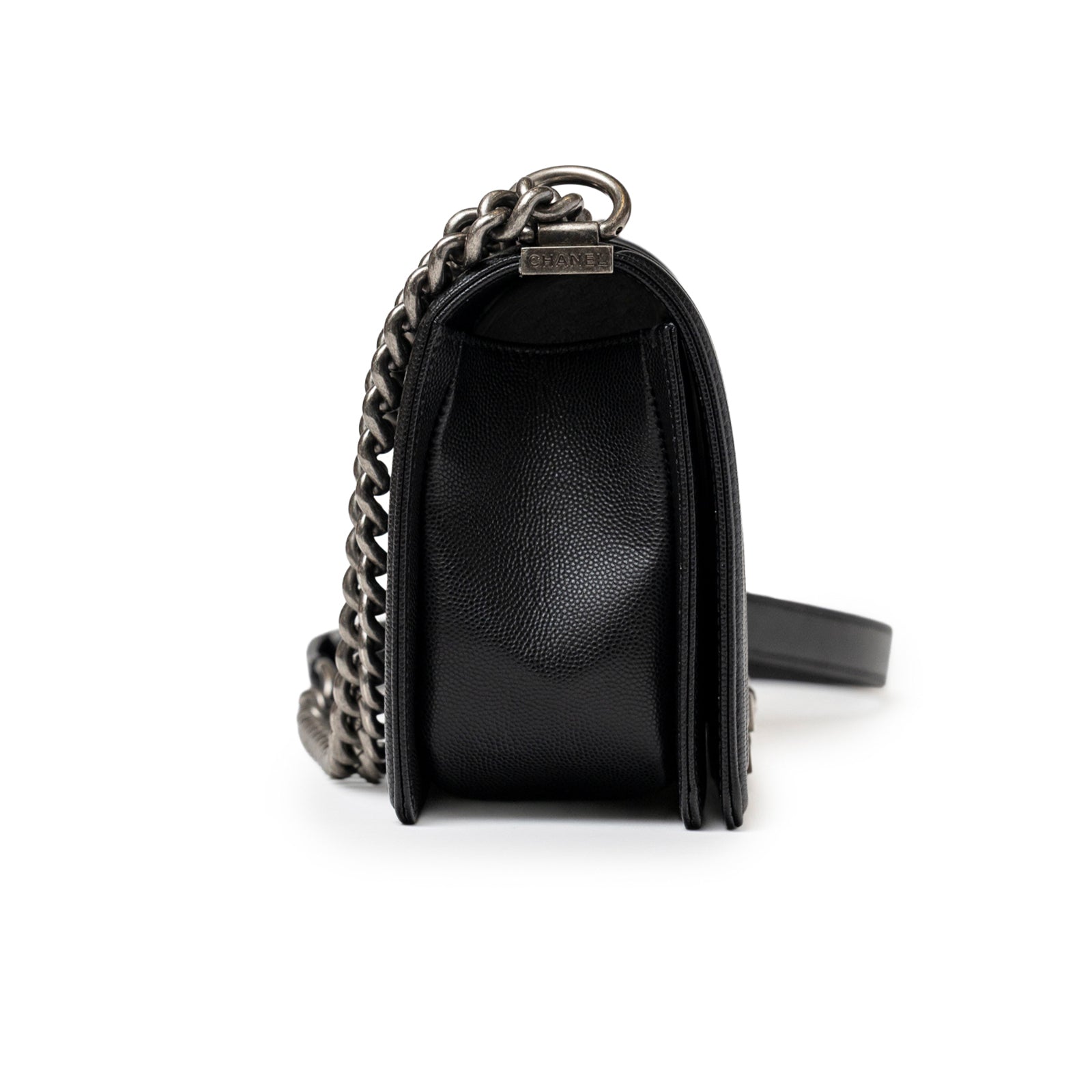 Side profile of Chanel Boy Bag Medium Black Caviar Aged Ruthenium Hardware showing texture and chain strap detail