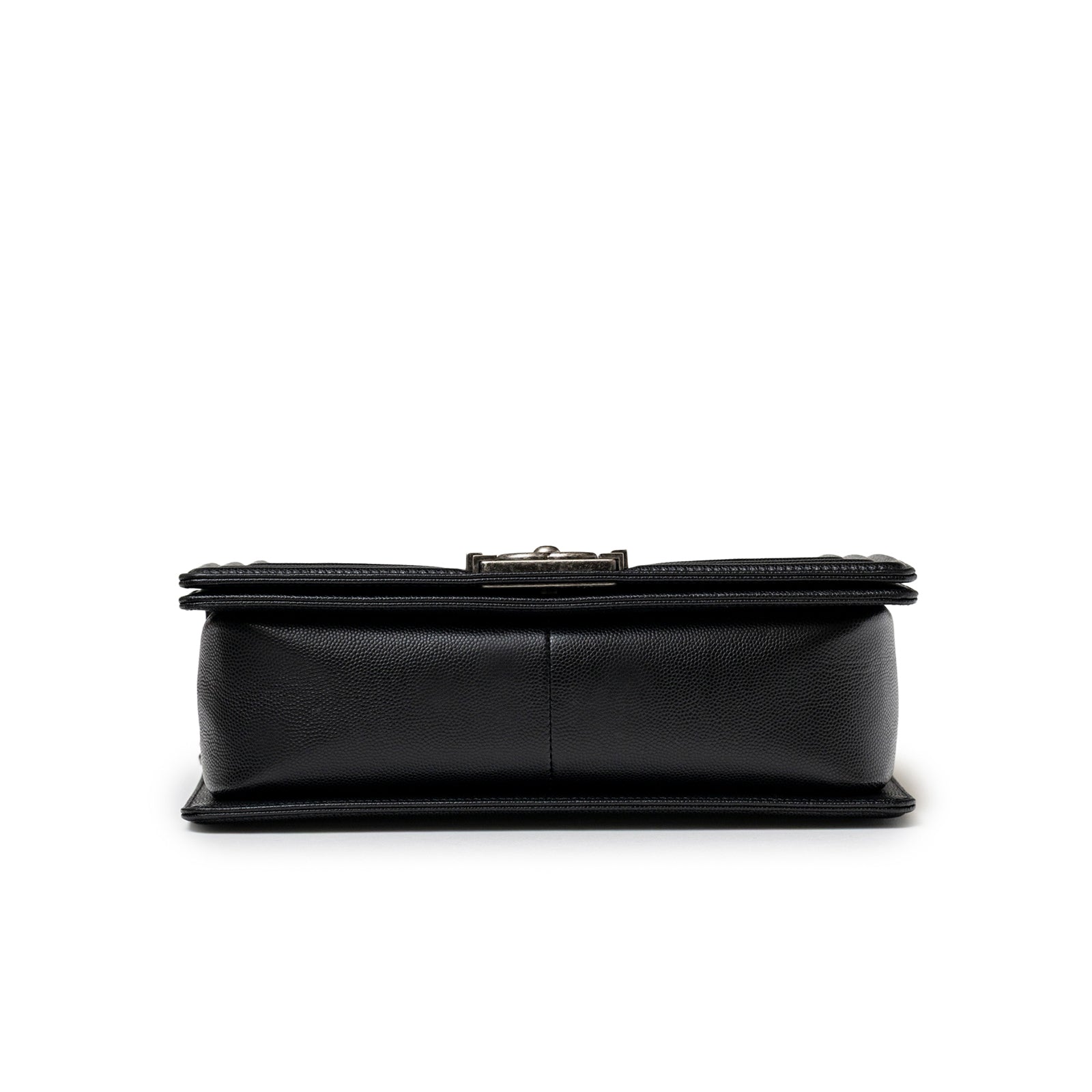 Bottom view of Chanel Boy Bag Medium Black Caviar Aged Ruthenium Hardware showing textured leather base and stitching detail