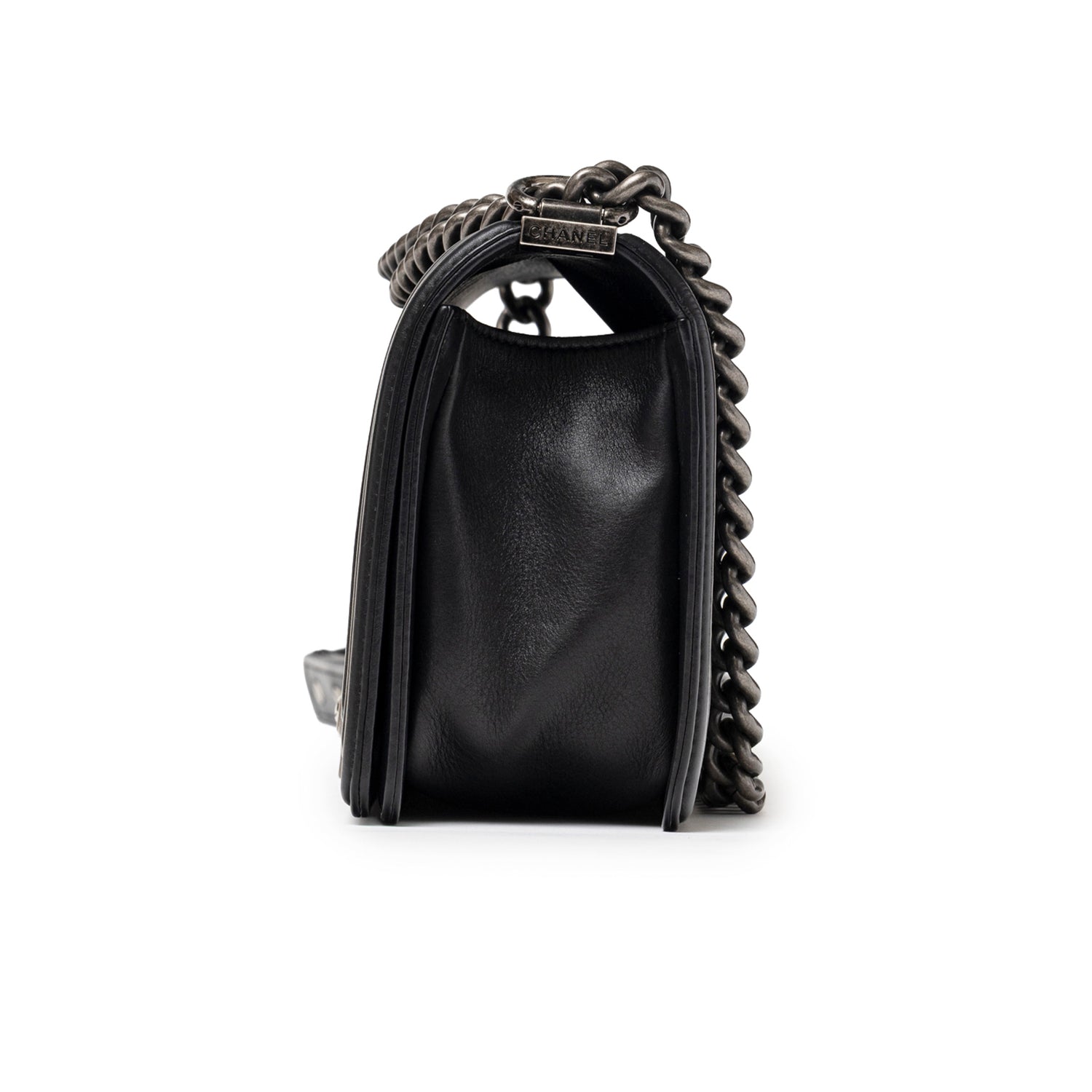 Side profile of Chanel Boy Bag Medium Black Lambskin Ruthenium Hardware showing chain strap detail
