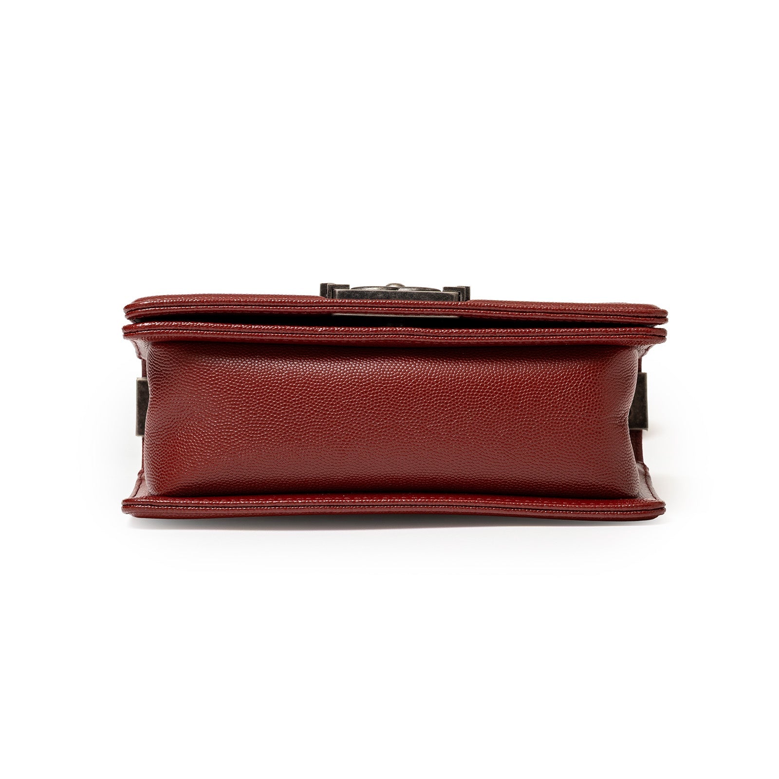 Bottom view of Chanel Small Boy Flap Bag Chevron Burgundy Caviar Palladium Hardware showing leather texture and structure