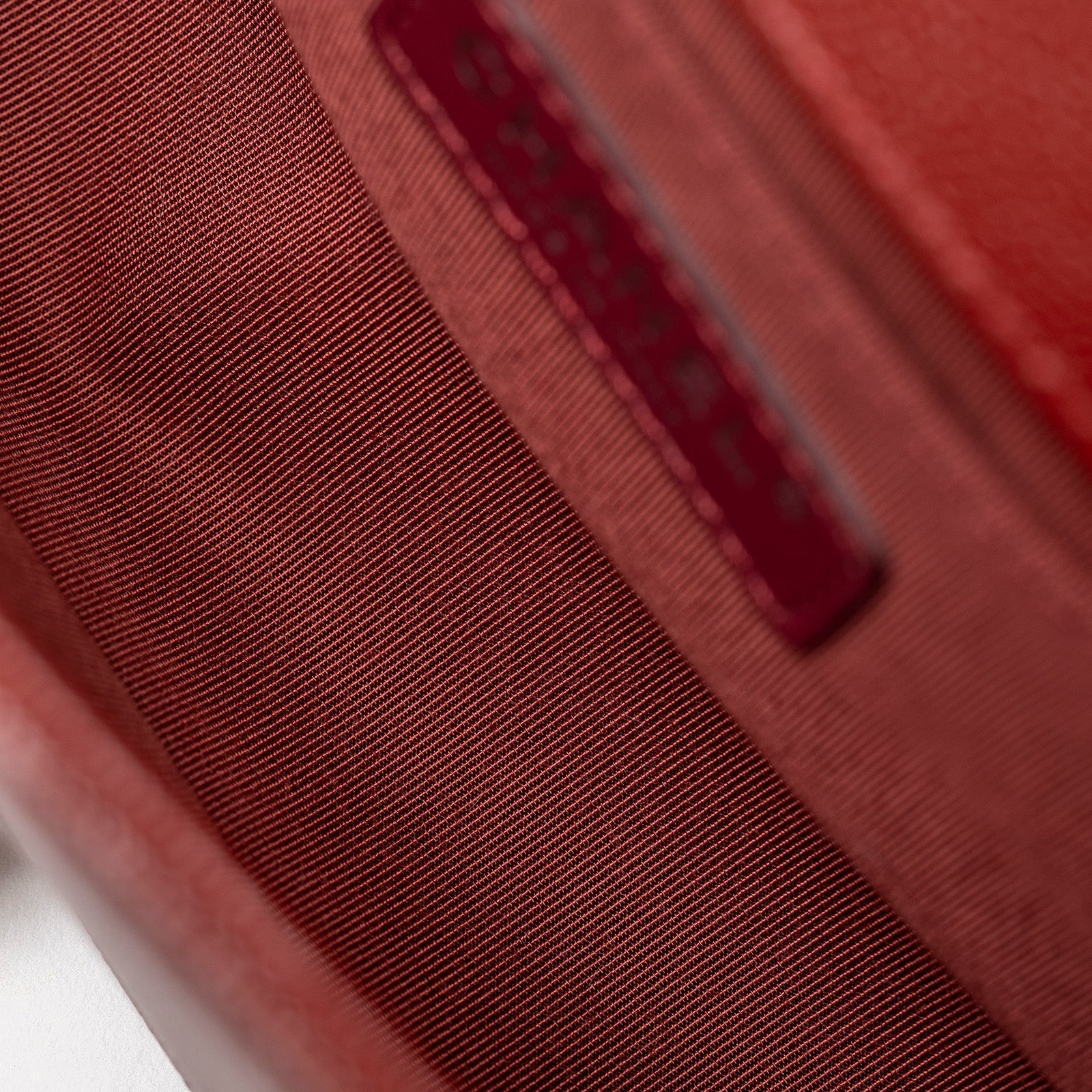 Interior view of the Chanel Small Boy Flap Bag Chevron Burgundy Caviar Palladium Hardware showing lining and label detail