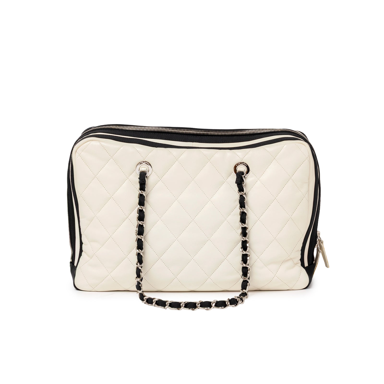 Back view of Chanel CC Quilted Zip Shoulder Bag White & Black Lambskin Palladium Hardware showing chain strap and zippered top closure