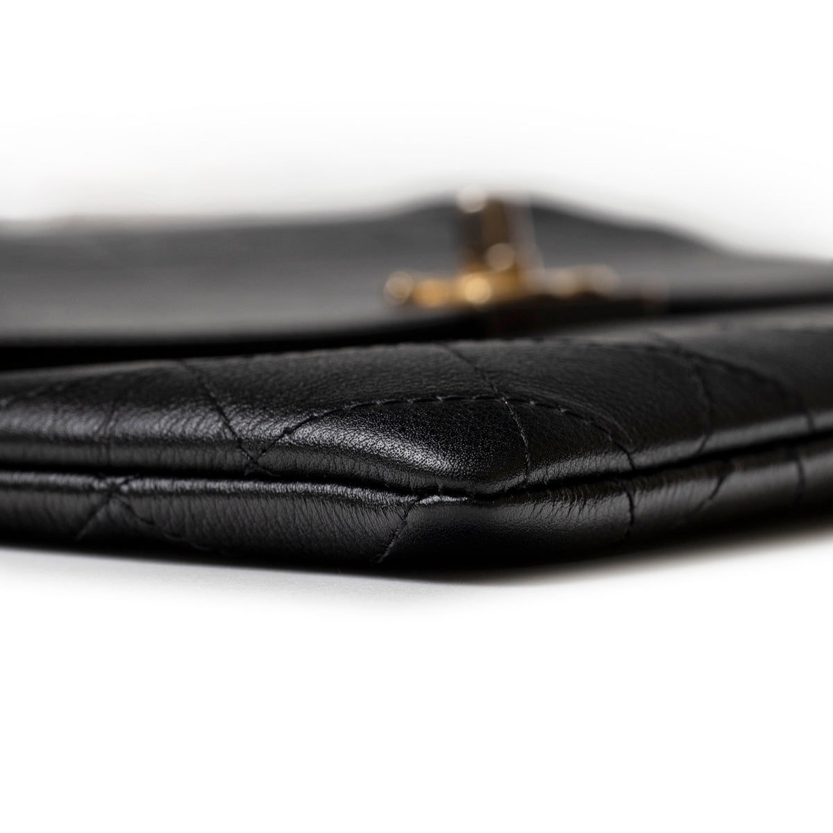Chanel Clutch Black Quilted Lambskin Gold and Palladium Hardware close up of quilted edge