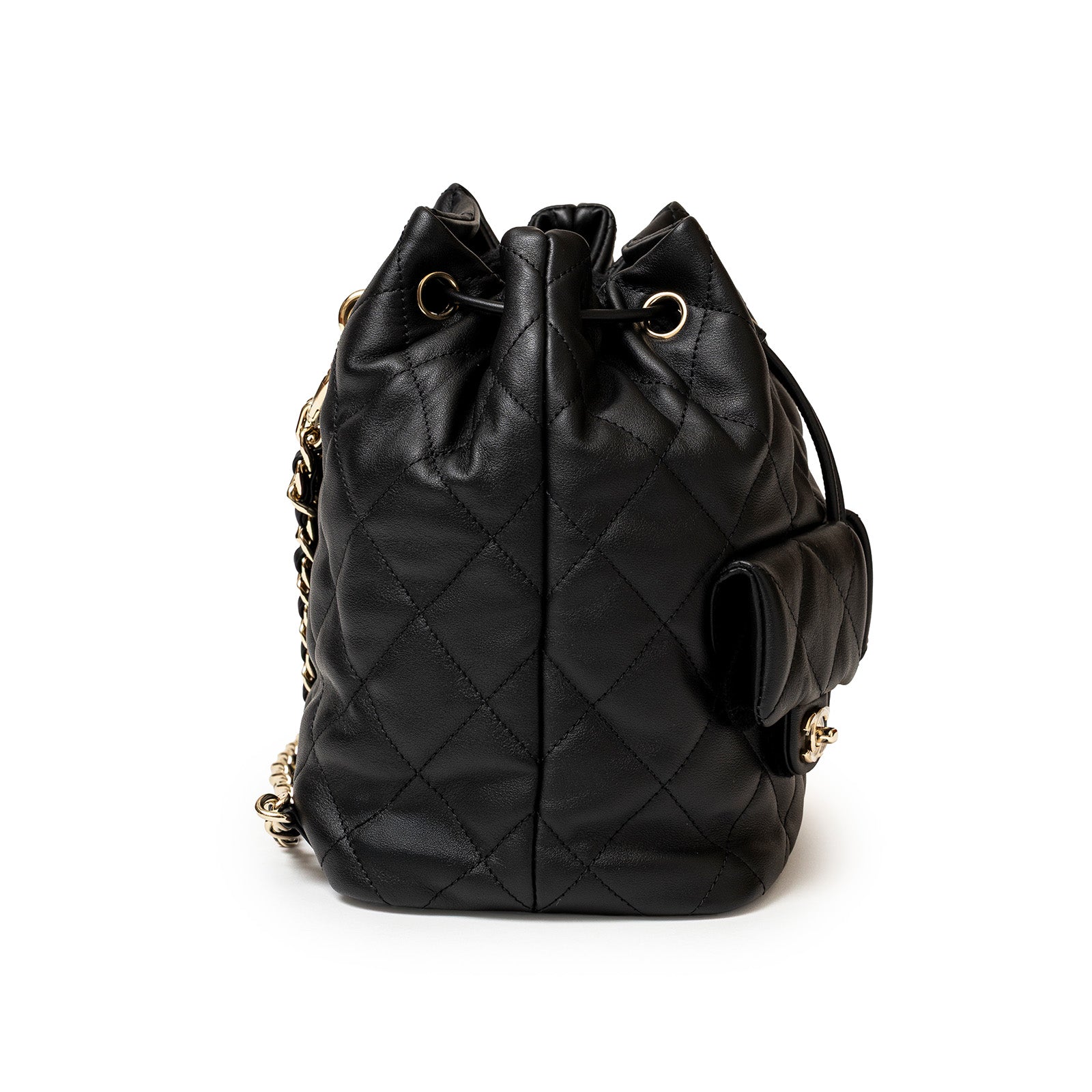 Side view of Chanel Coco Mellow Backpack Calf Black Permabrass Hardware 23B showing quilted leather texture
