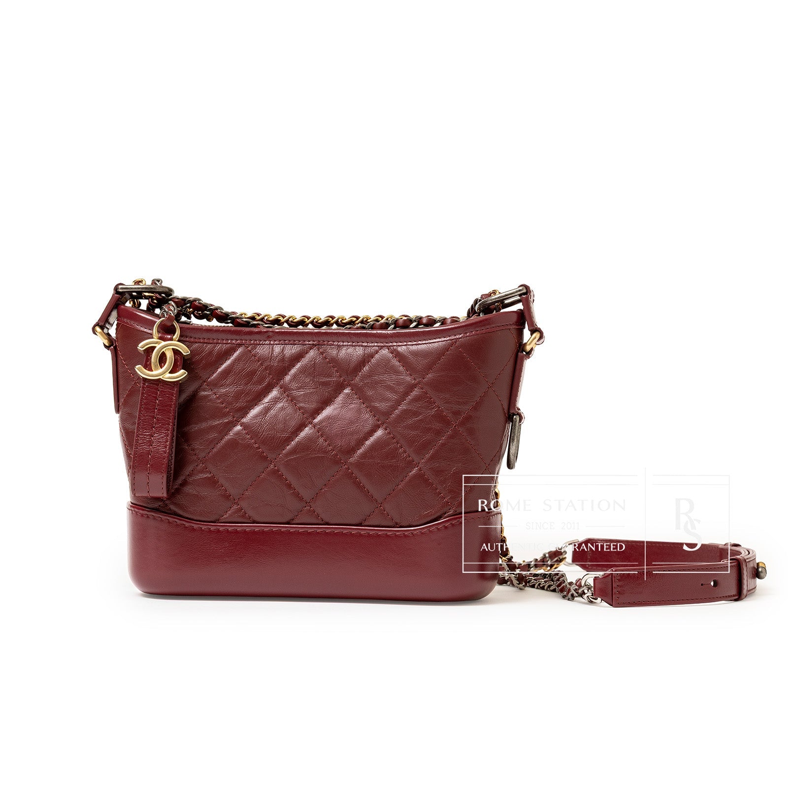 Side view of Chanel Gabrielle Hobo Bag Burgurdy Palladium and Gold Hardware with quilted leather and chain strap detail