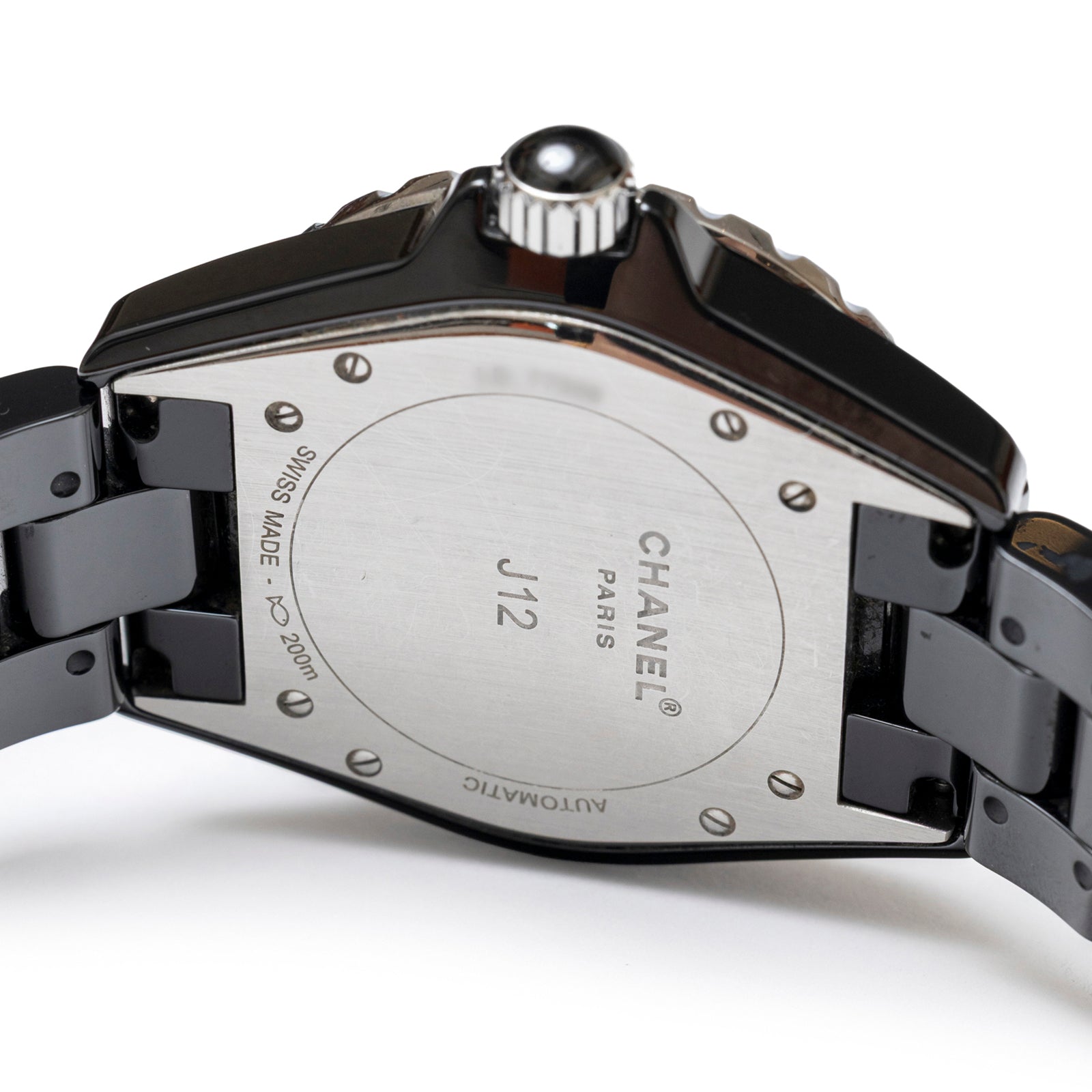 Close-up of back case and bracelet detail of Chanel J12 38mm Ceramic Black Pave Diamond Quartz Watch showing crown and engravings