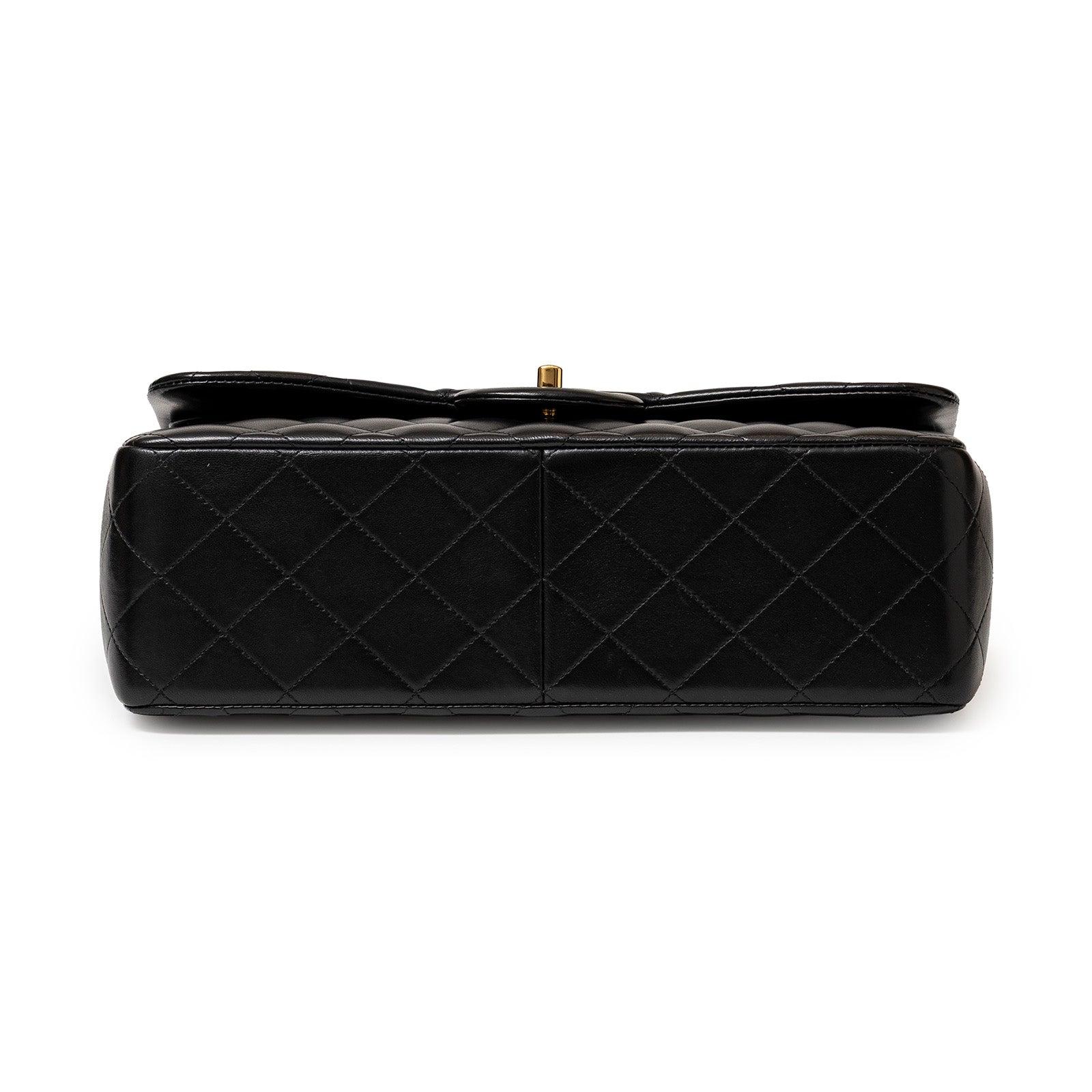 Bottom view of Chanel Jumbo Classic Double Flap Bag Black Lambskin Gold Hardware showing quilted leather pattern