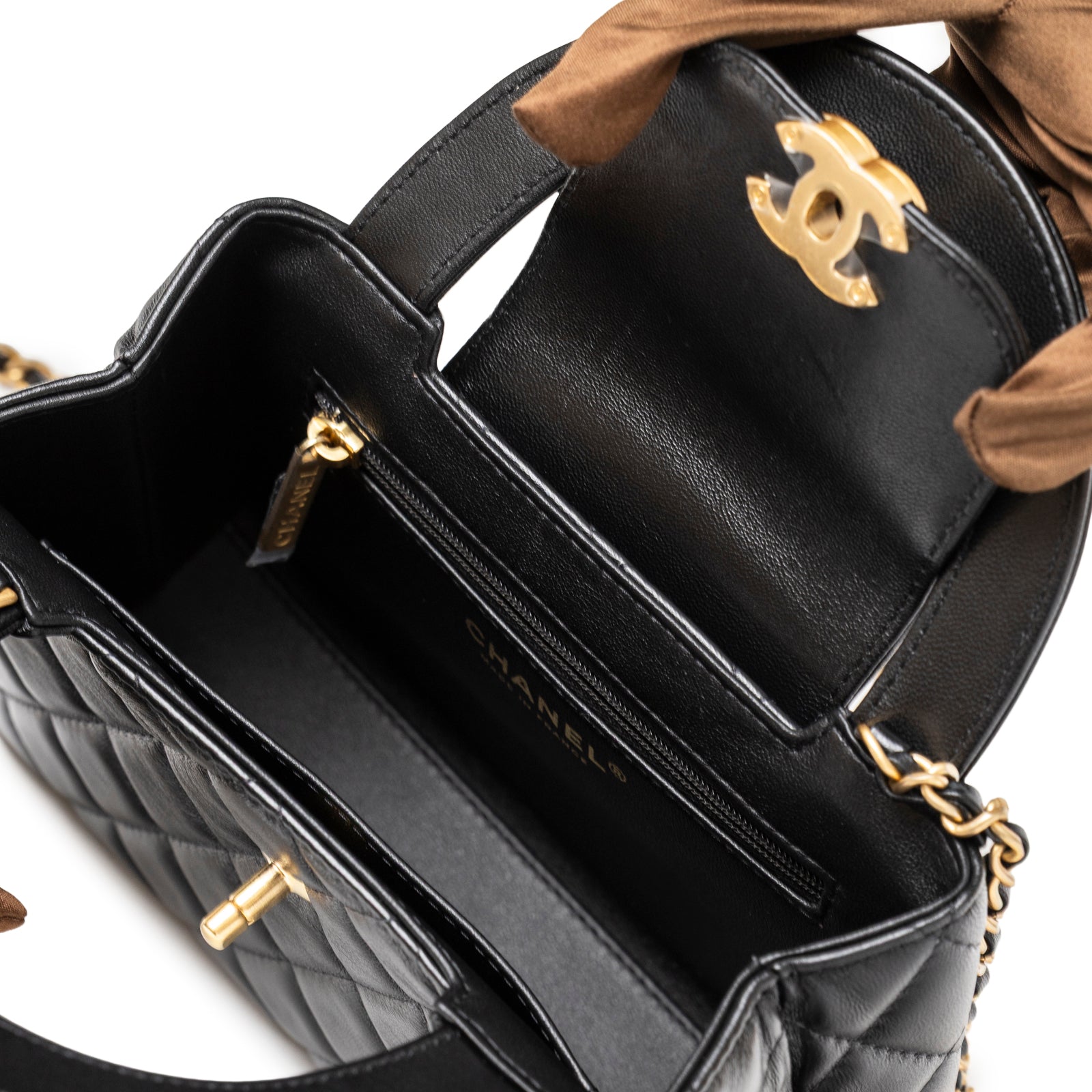 Open interior view of Chanel Kelly Shopper Small Black Shiny Aged Calfskin Brushed Gold Hardware showing zipper pocket and chain strap