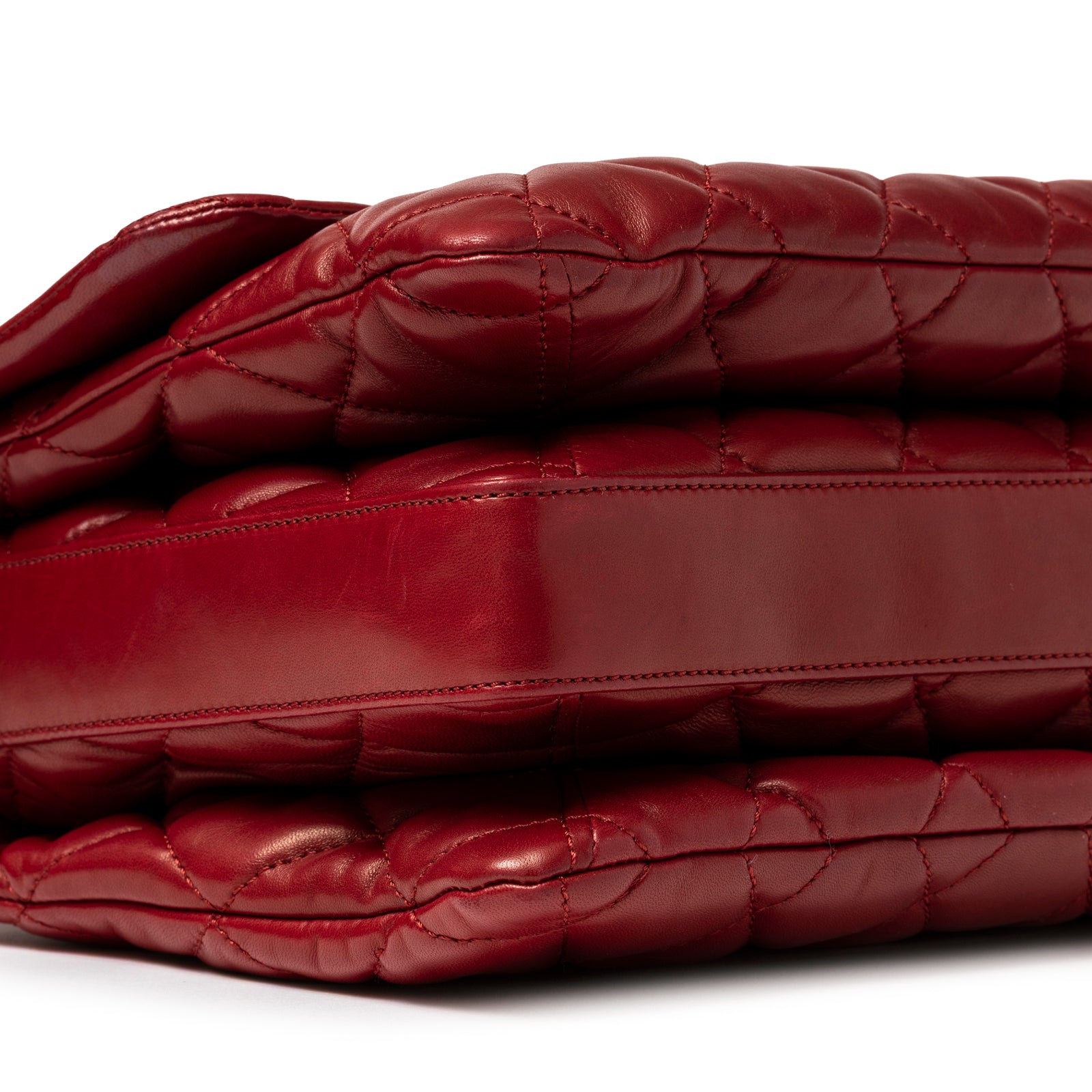 Close-up corner view of Chanel Maxi 3 Accordion Flap Bag Lambskin Red Palladium Hardware showing stitched leather layers
