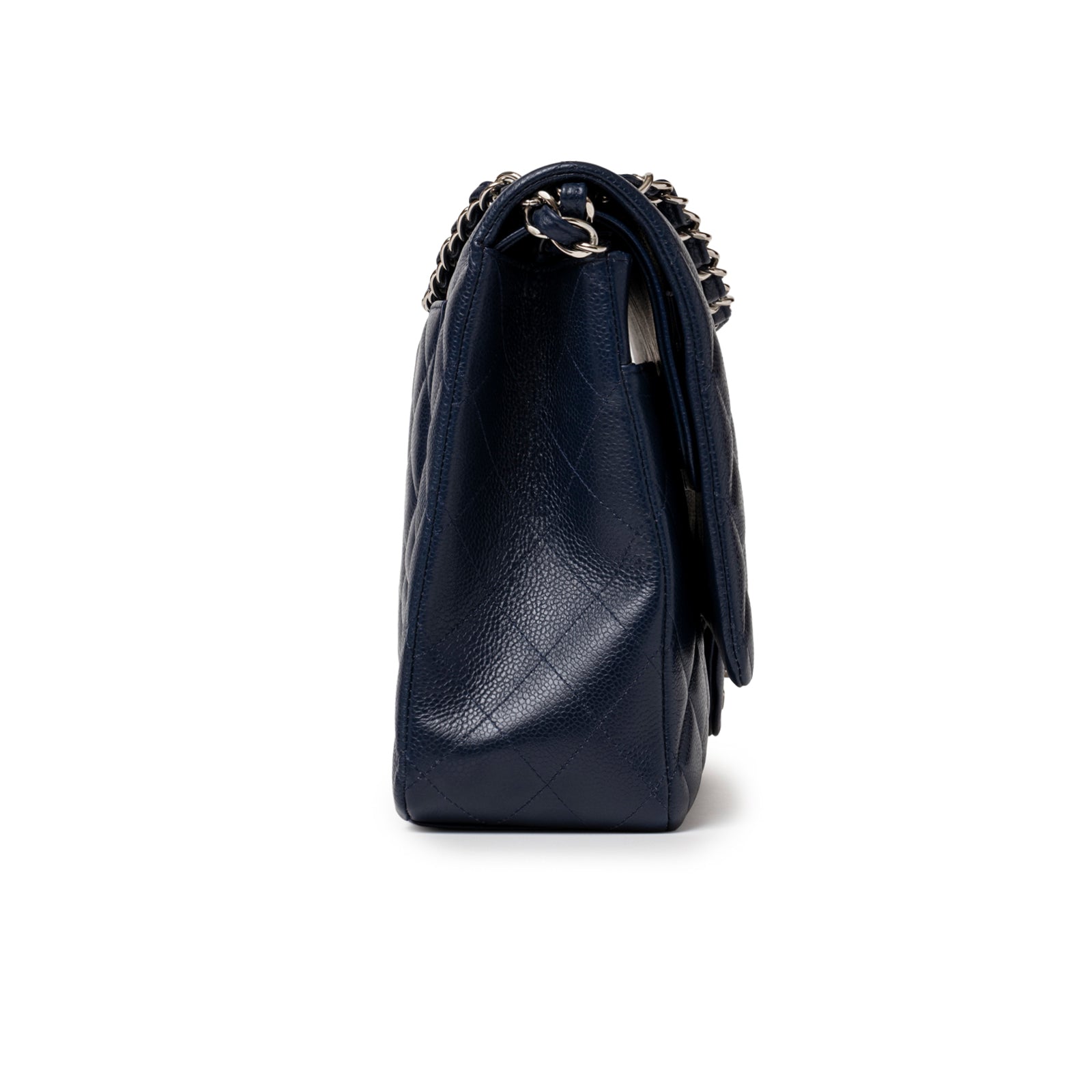 Side profile of Chanel Maxi Classic Double Flap Caviar Navy Palladium Hardware showing textured navy leather and chain strap attachment