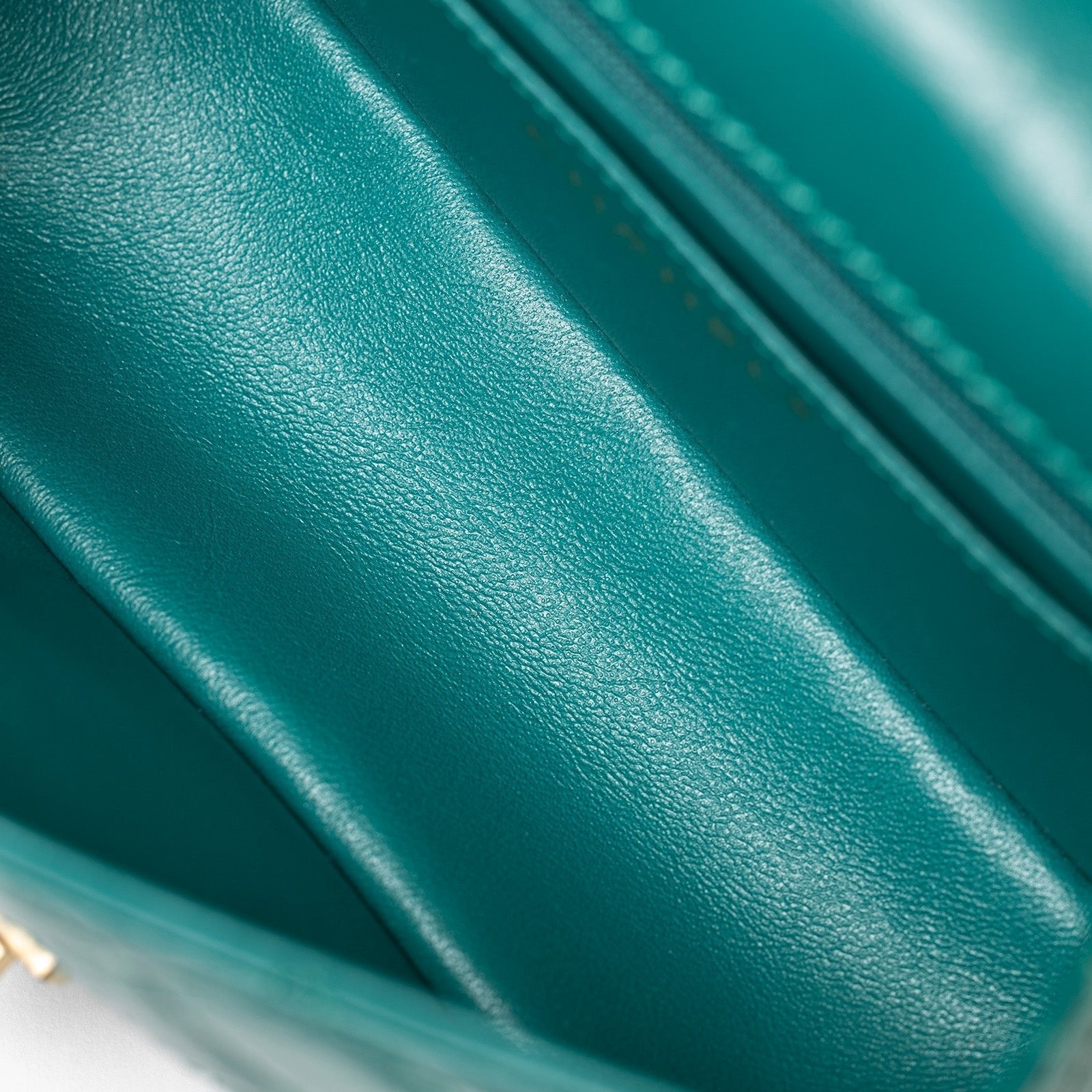 Close-up interior shot of soft green calf leather in Chanel Mini Reissue 2.55 Flap Bag Green Calf Brushed Gold Hardware