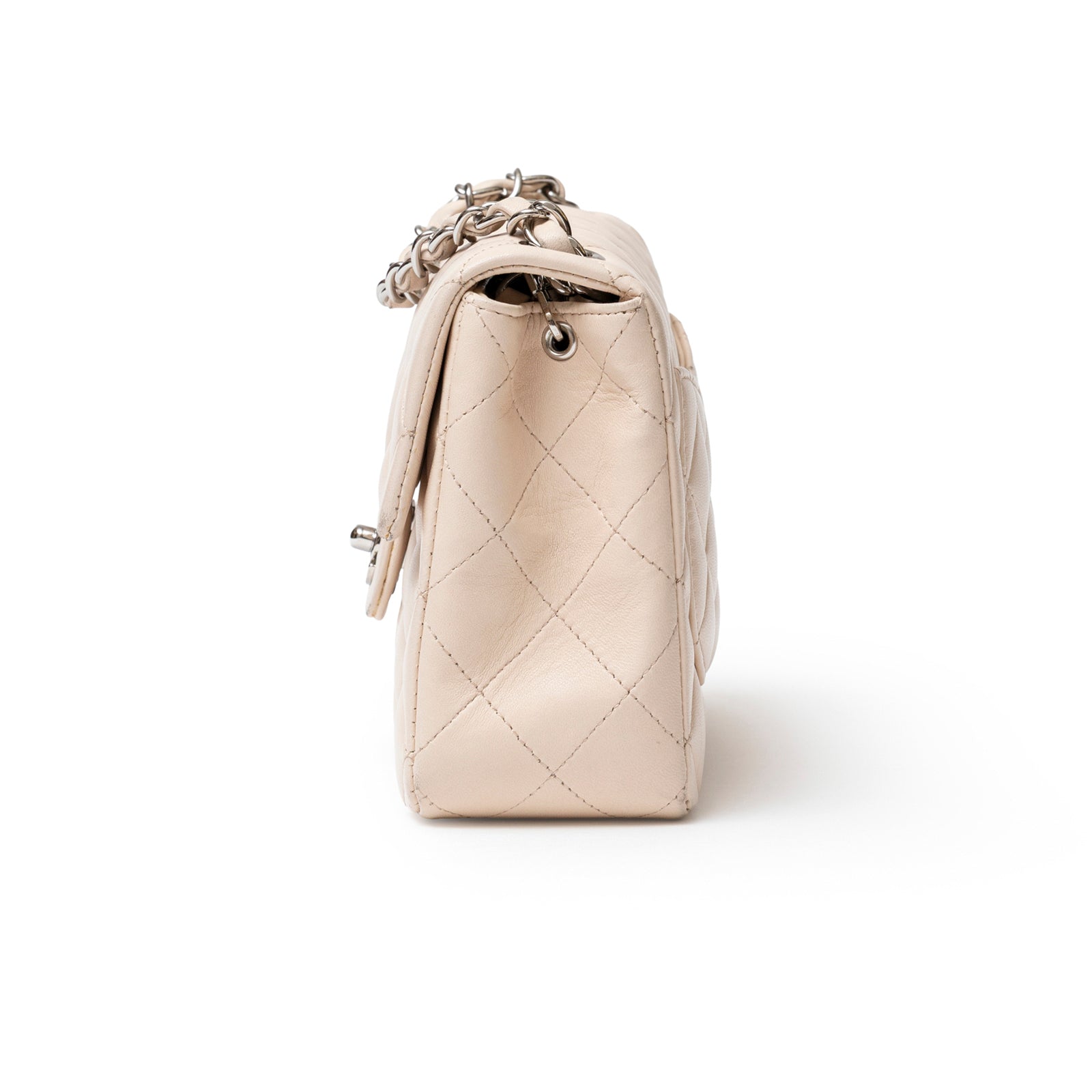 Side view of Chanel Mini Square Single Flap Lambskin Beige Silver Hardware showing quilted leather and chain strap detail