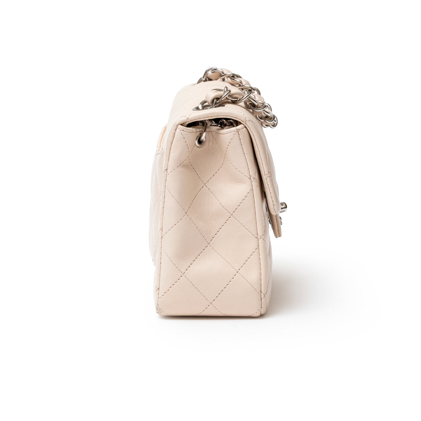 Side view of Chanel Mini Square Single Flap Lambskin Beige Silver Hardware showing quilted stitching and chain strap detail