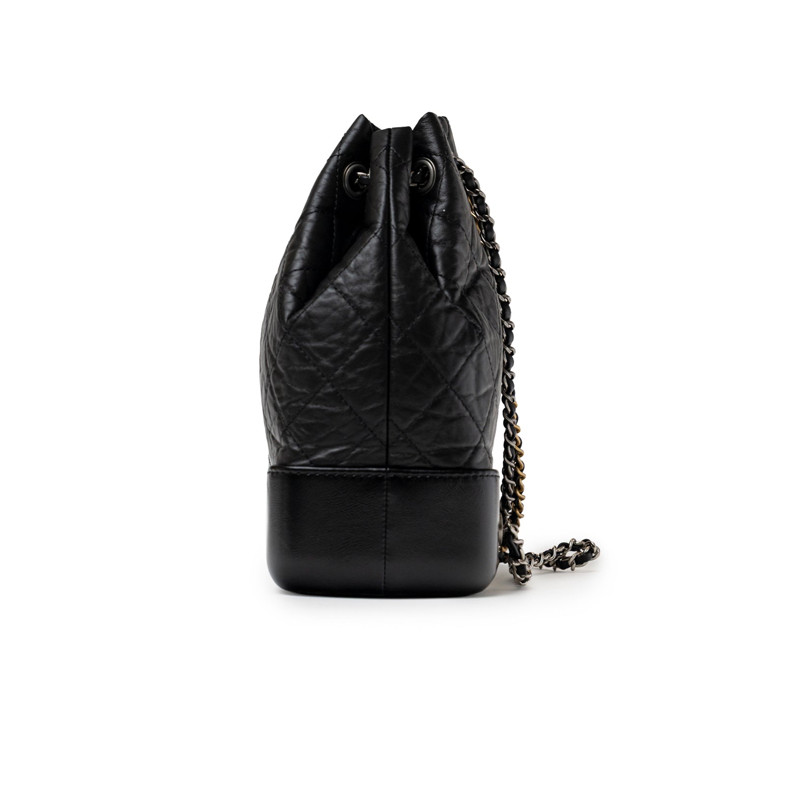 Side view of Chanel Small Gabrielle Backpack Black Aged Calfskin Mixed Metal Hardware showing quilted leather and chain strap details