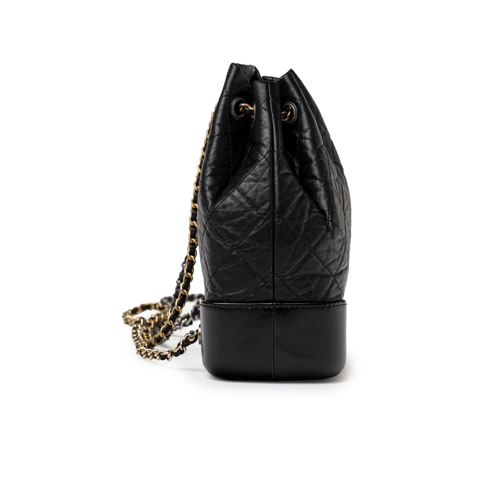 Side view of Chanel Small Gabrielle Backpack Black Aged Calfskin Mixed Metal Hardware showing quilted leather and chain strap detail
