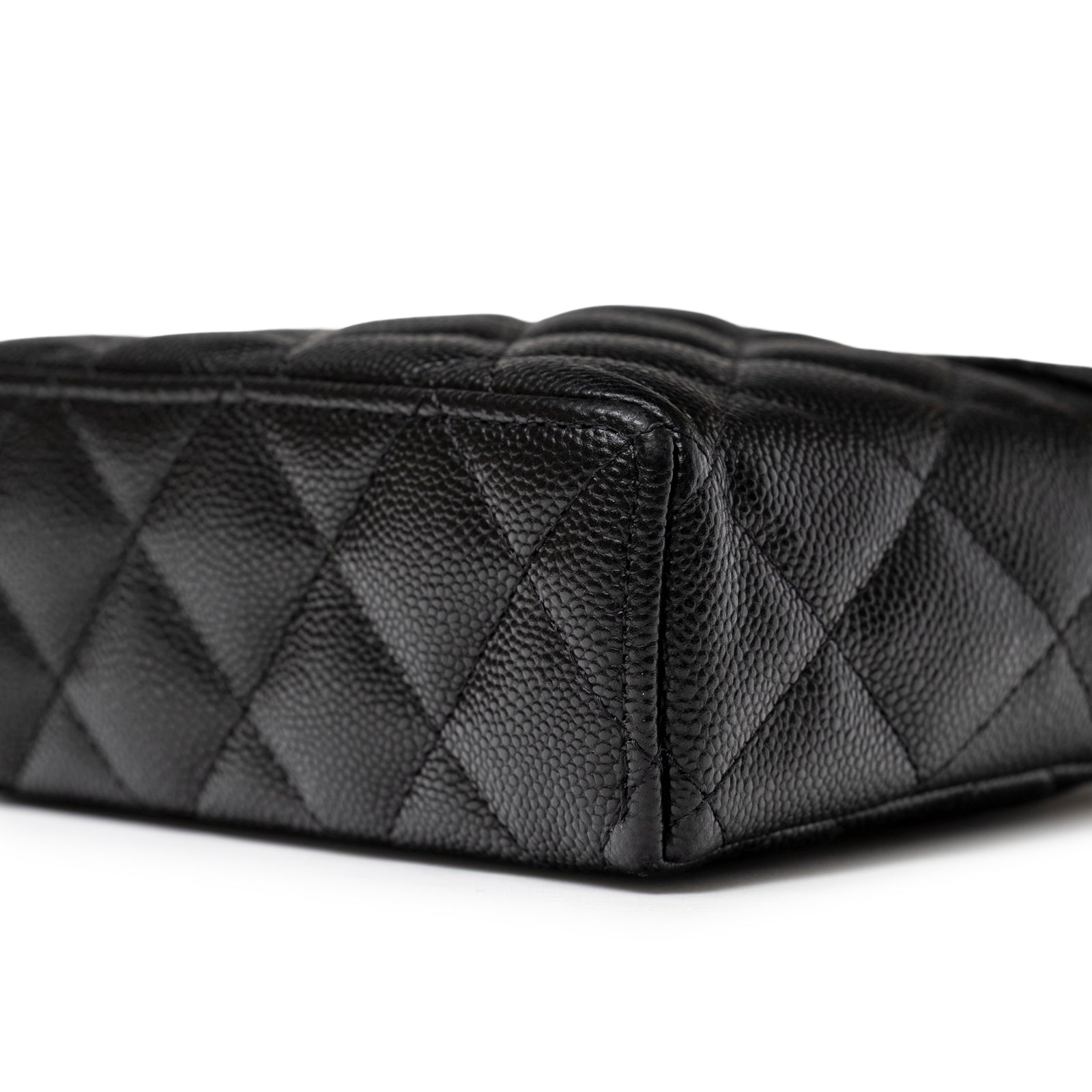 Close-up of the bottom corner showing quilted black caviar leather on Chanel Top Handle Vanity with Chain Black Caviar Light Gold Hardware