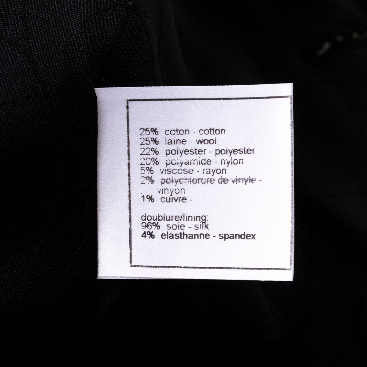 Close-up of fabric composition label inside Chanel Vintage Tweed Jacket with Butterfly Bow Tie Black & White showing material blend details