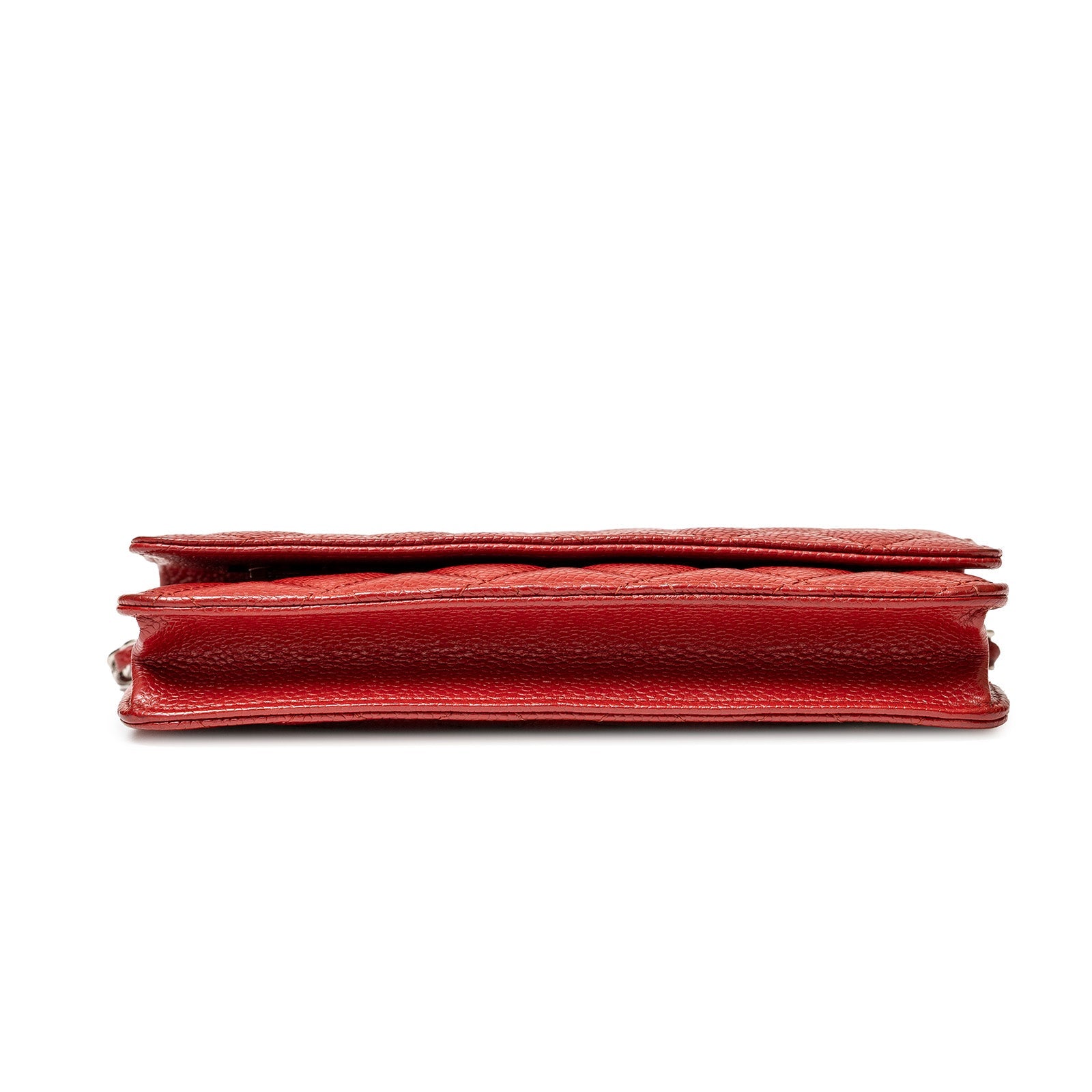 Side profile of Chanel Wallet On Chain Red Caviar Palladium Hardware showing texture and slim design