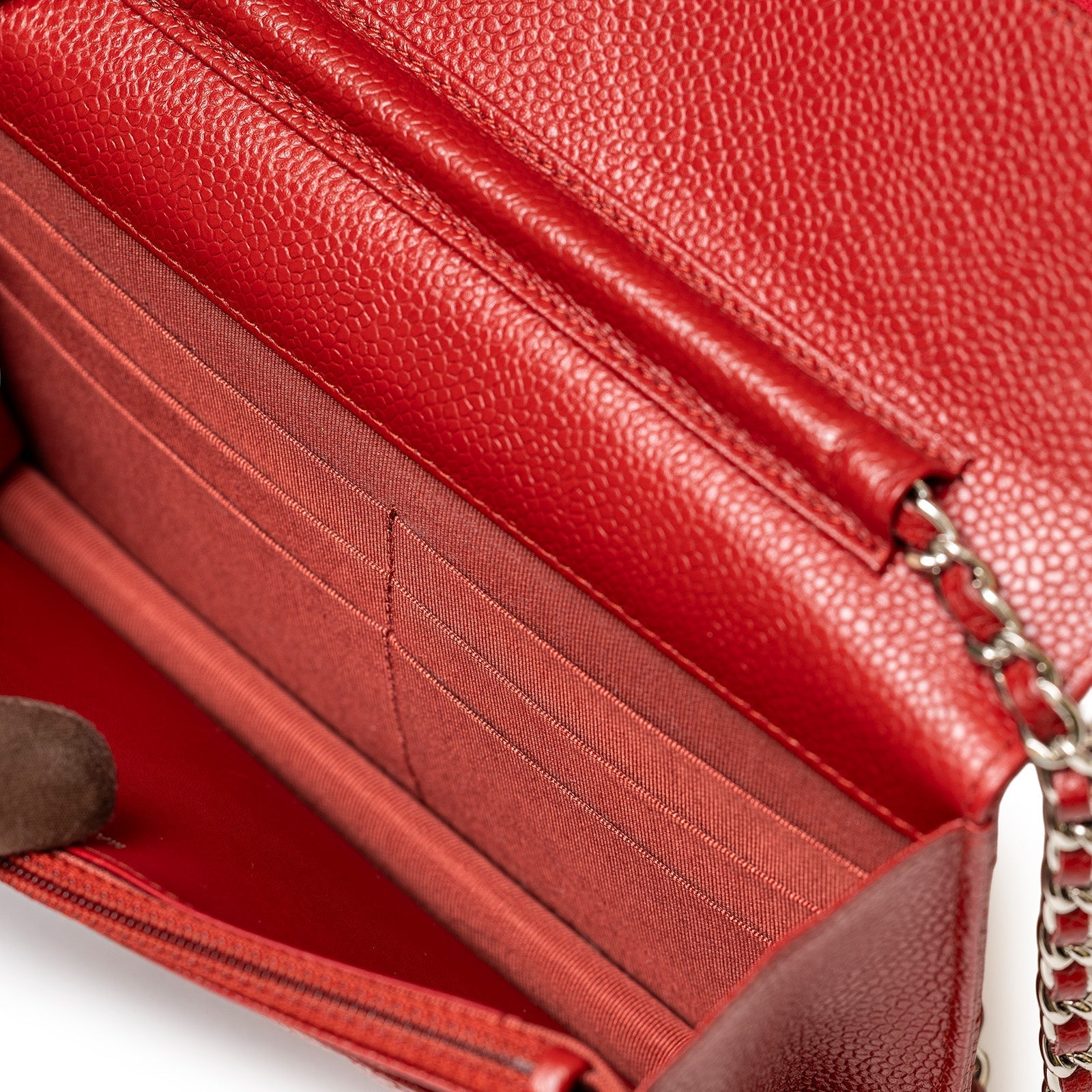 Close-up interior view of Chanel Wallet On Chain Red Caviar Palladium Hardware showing card slots and chain strap detail