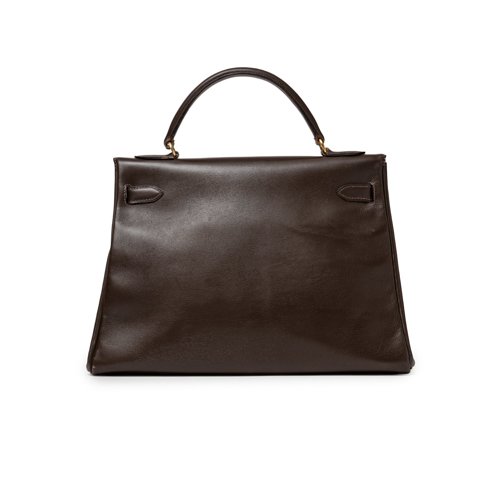 Back view of Hermès 1974 Vintage Kelly 32 Marron Foncé Box Gold Hardware showing smooth leather and handle detail