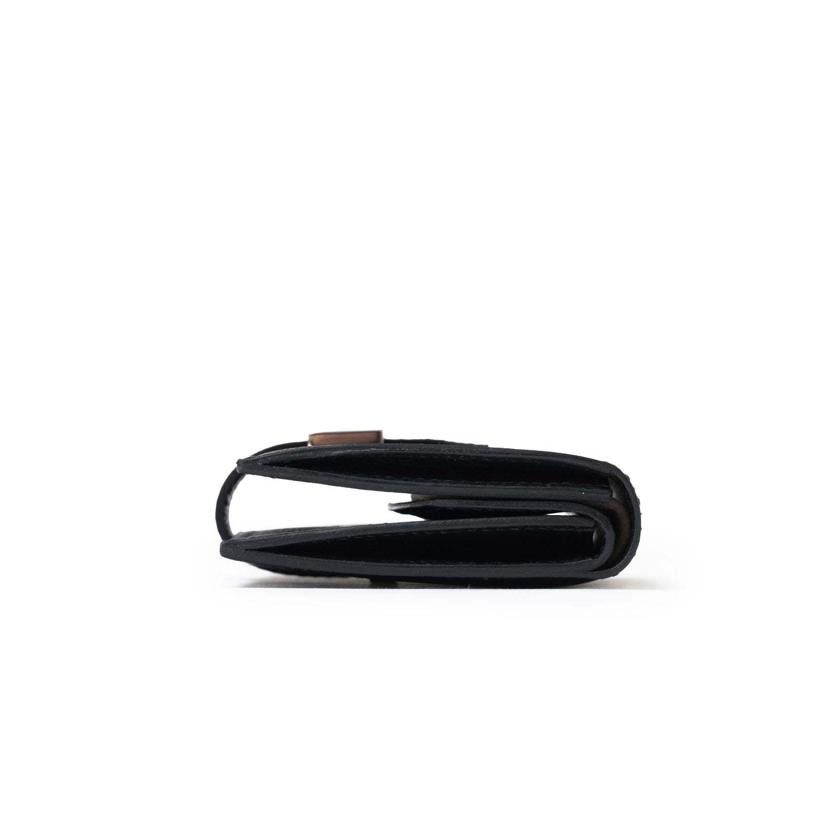 Side profile of Hermès Bearn Mini Wallet Black Epsom Palladium Hardware showing folded sleek design.