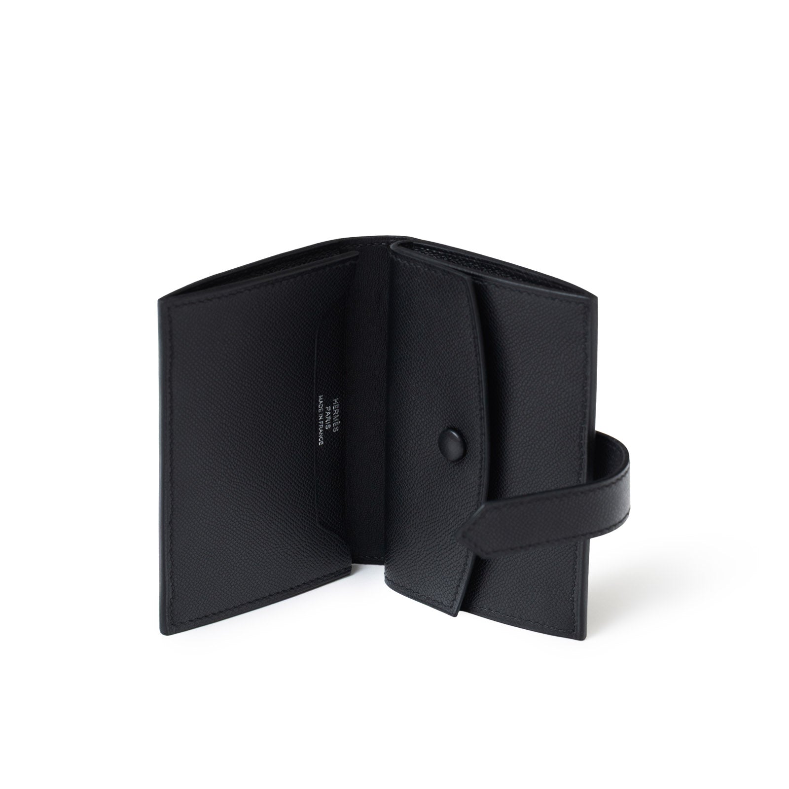 Open view of Hermès Bearn Mini Wallet Monochrome Madame So Black showing interior compartments and snap closure strap