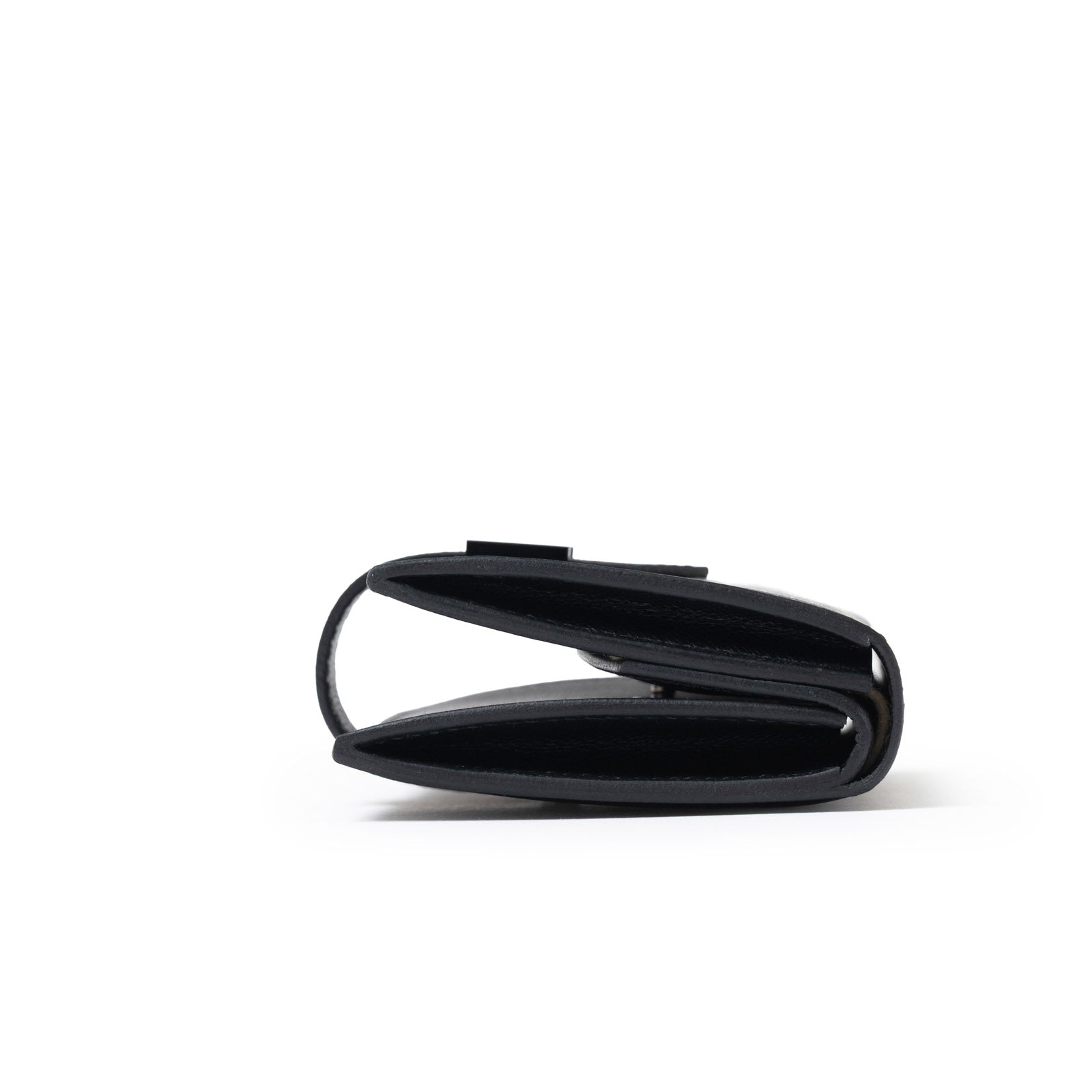 Side view of Hermès Bearn Mini Wallet Monochrome Madame So Black showing its slim folded design and edges
