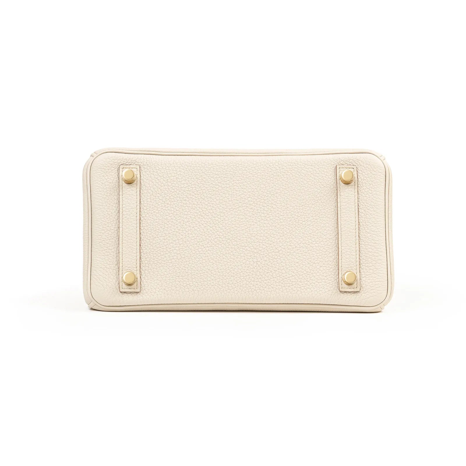 Bottom view of Hermès Birkin 25 Beton Togo leather showing gold hardware feet and textured leather surface
