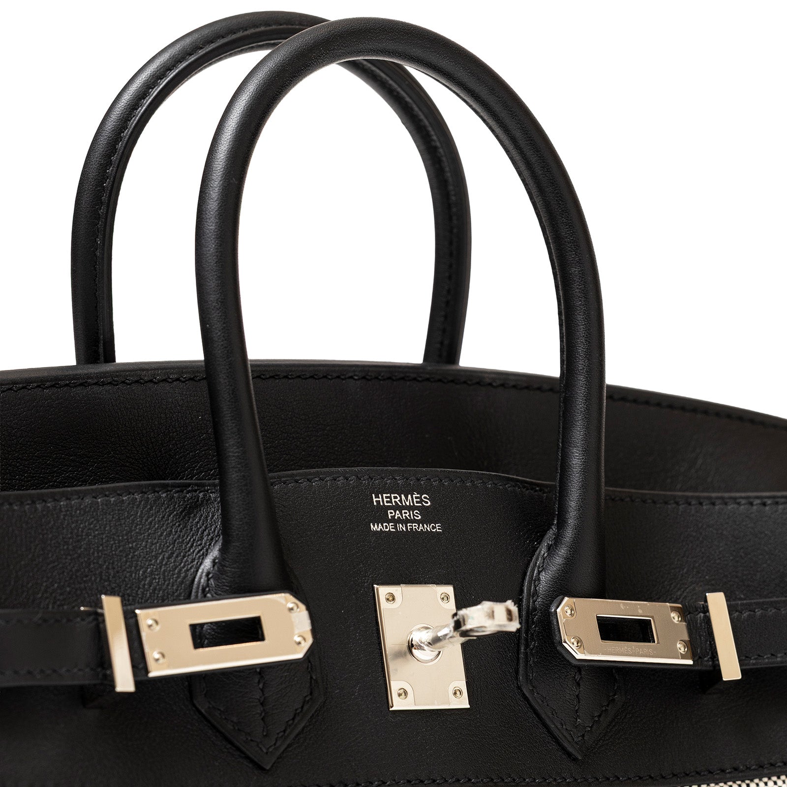 Front Close-up of luxury Hermès Birkin 25 Black Swift leather bag hardware