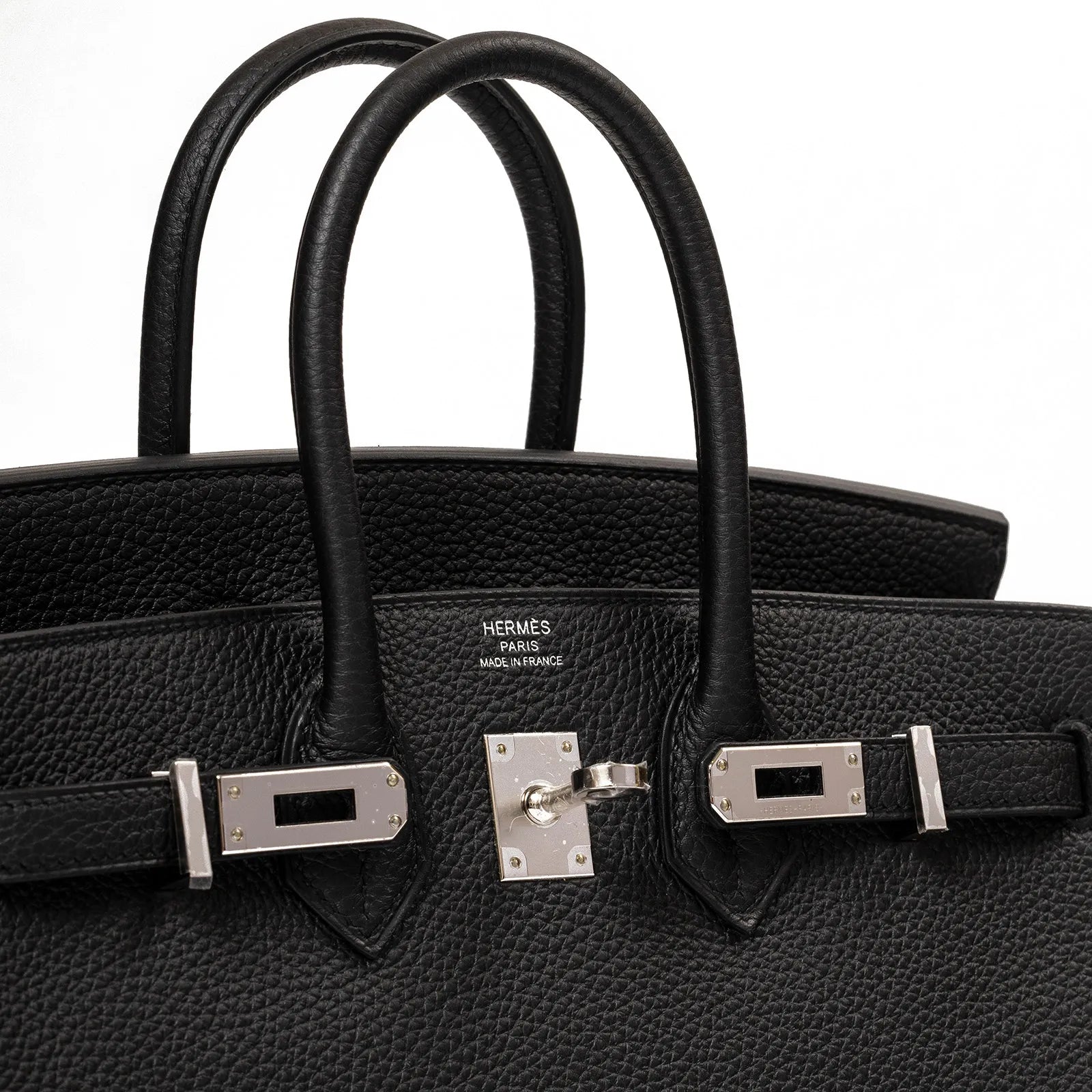 Close-up of black Togo leather Hermès Birkin 25 showing front palladium hardware and handles