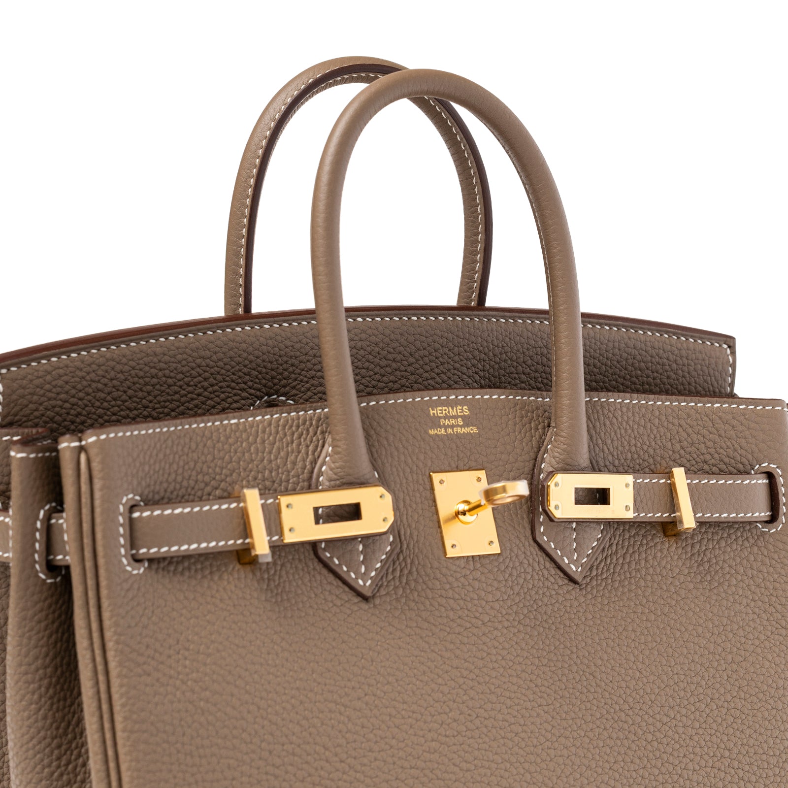 Angled close-up of Hermès Birkin 25 Etoupe Togo Gold Hardware showing textured leather and gold clasp details