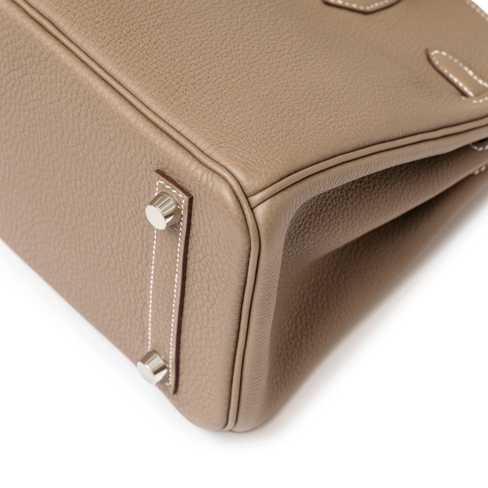 Close-up of Hermès Birkin 25 Etoupe Togo Palladium Hardware showing bottom corner and metal feet detail