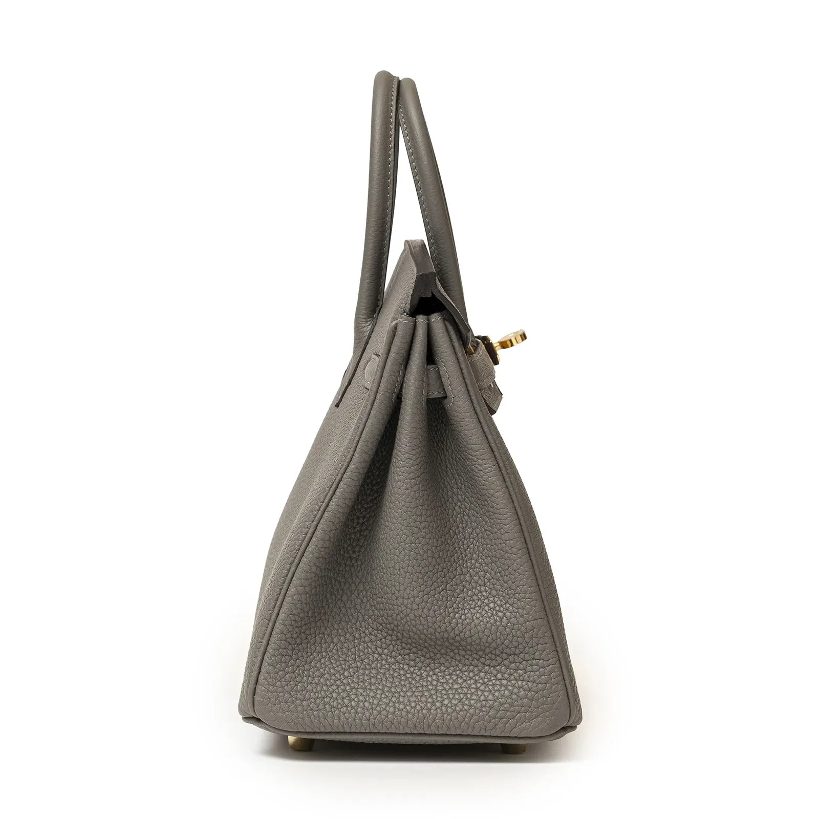 Side profile of Hermès Birkin 25 in gris meyer togo leather with gold hardware and structured silhouette