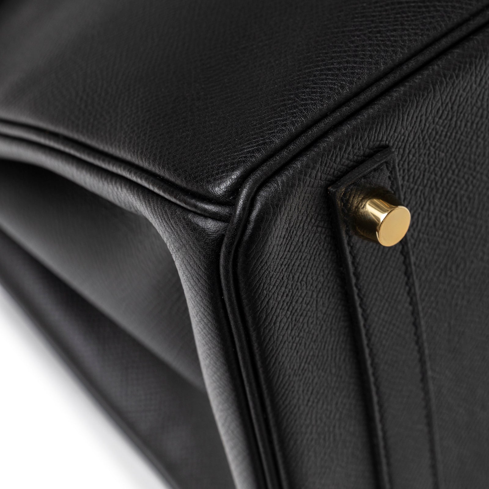 Close-up of corner on Hermès Birkin 30 Black Epsom Gold Hardware showing pebbled leather and gold stud detail