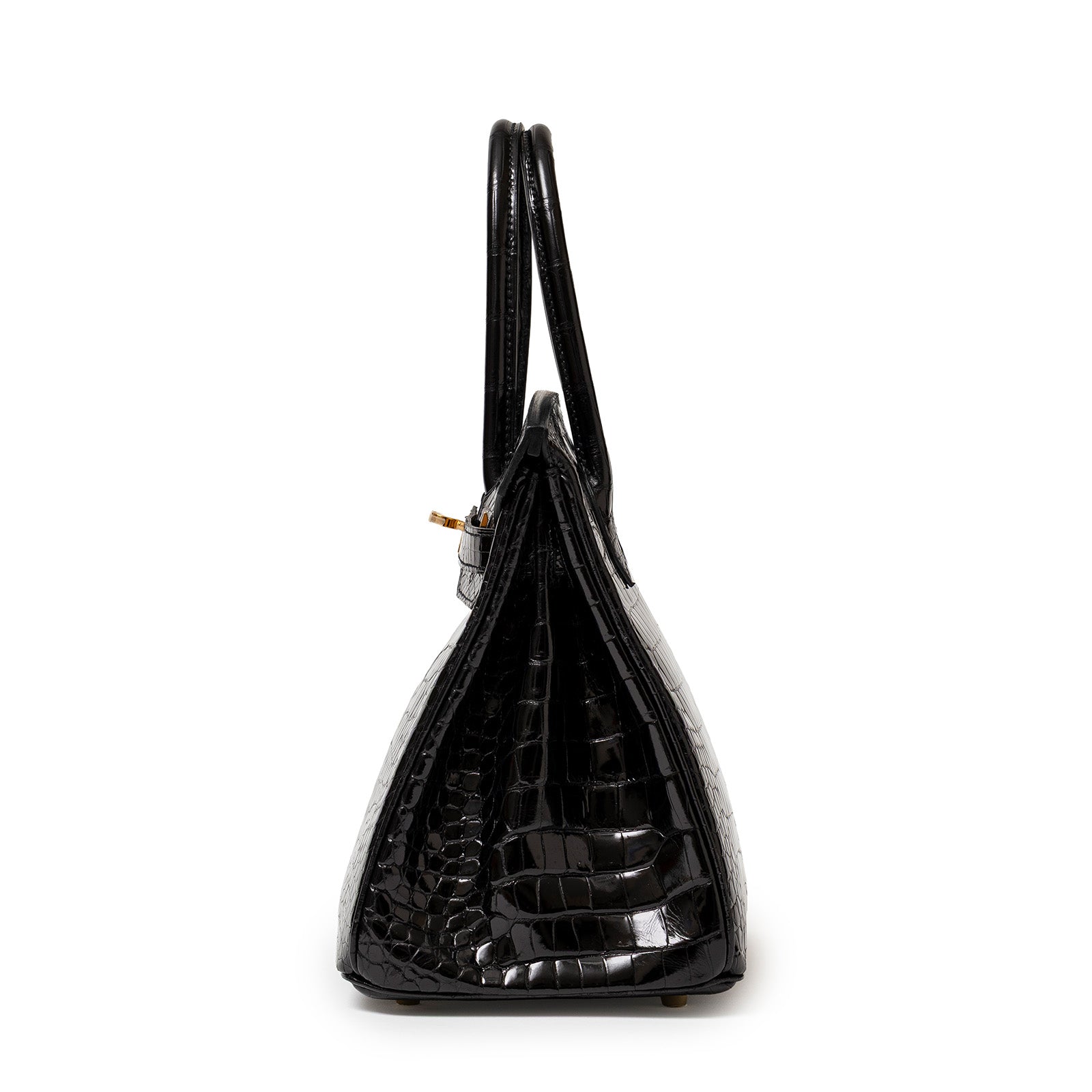 Side view of Hermès Birkin 30 Black Shiny Porosus Crocodile with gold hardware showing structured silhouette.