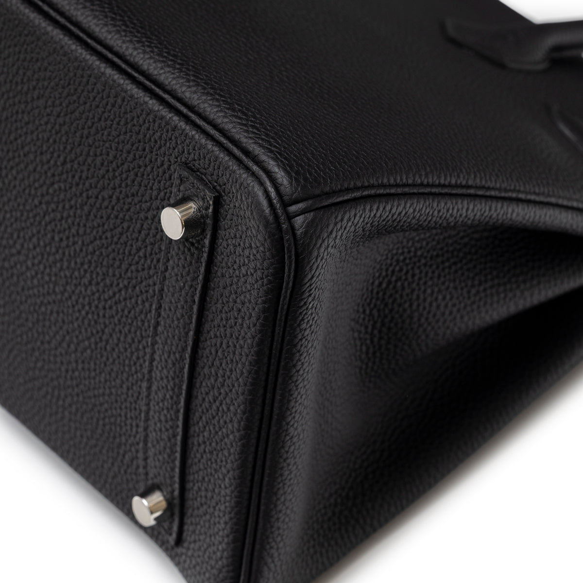 Close-up of bottom corner and palladium feet on Hermès Birkin 30 Black Togo Palladium Hardware handbag