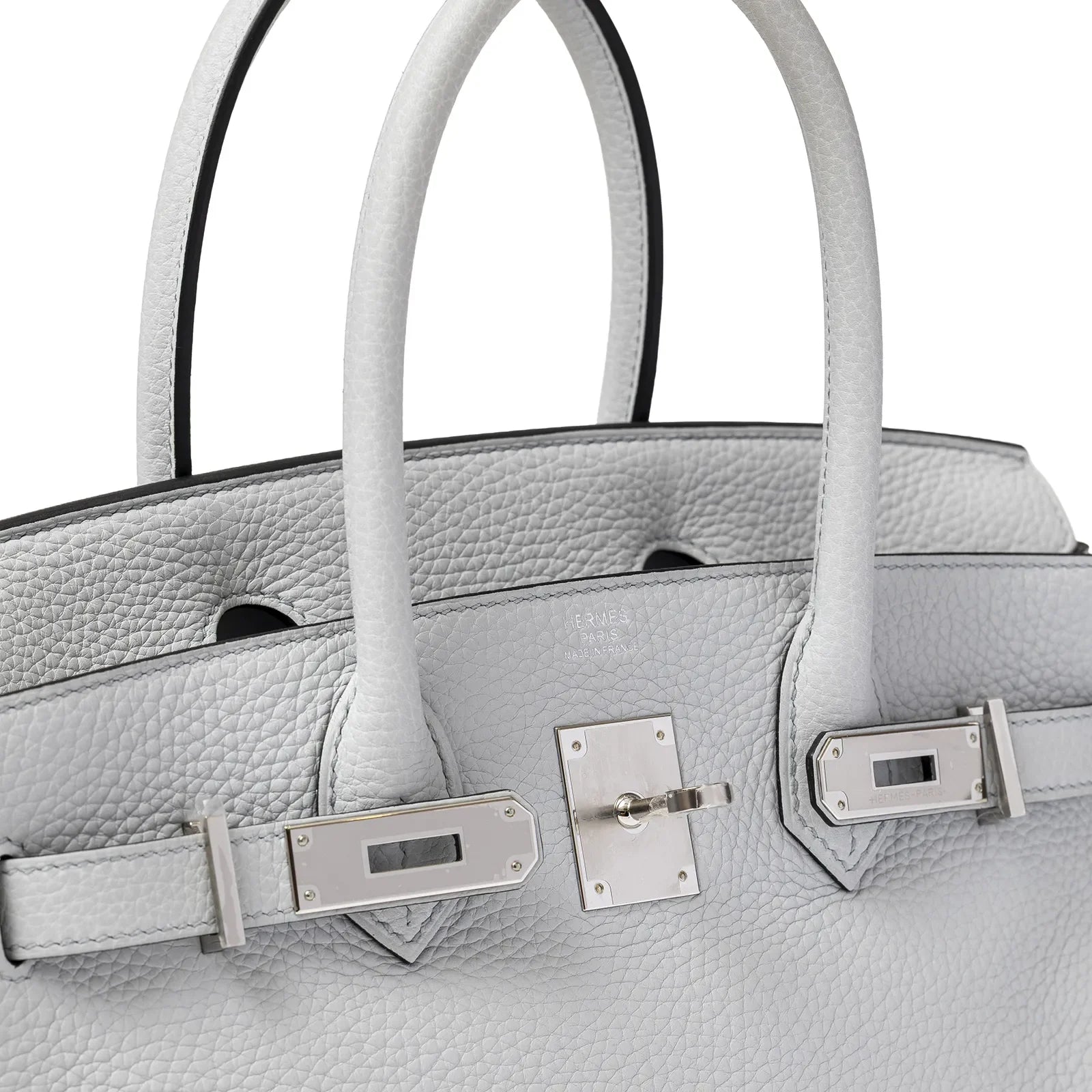 Close-up of pale blue textured leather Hermès Birkin 30 with polished palladium hardware and rolled handles