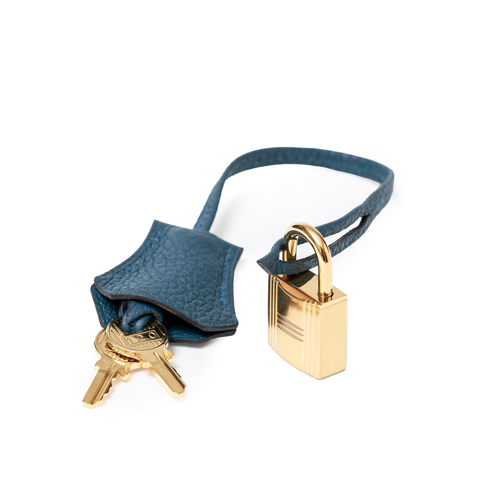 Close-up of gold lock and keys on Hermès Birkin 30 Colvert Togo Gold Hardware clochette accessory