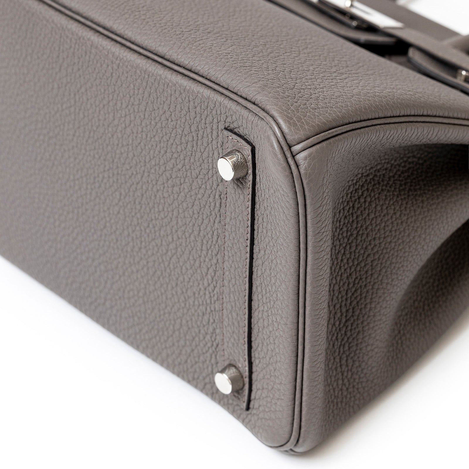 Close-up of Hermès Birkin 30 Etain Togo leather bag corner with palladium hardware by Hermès