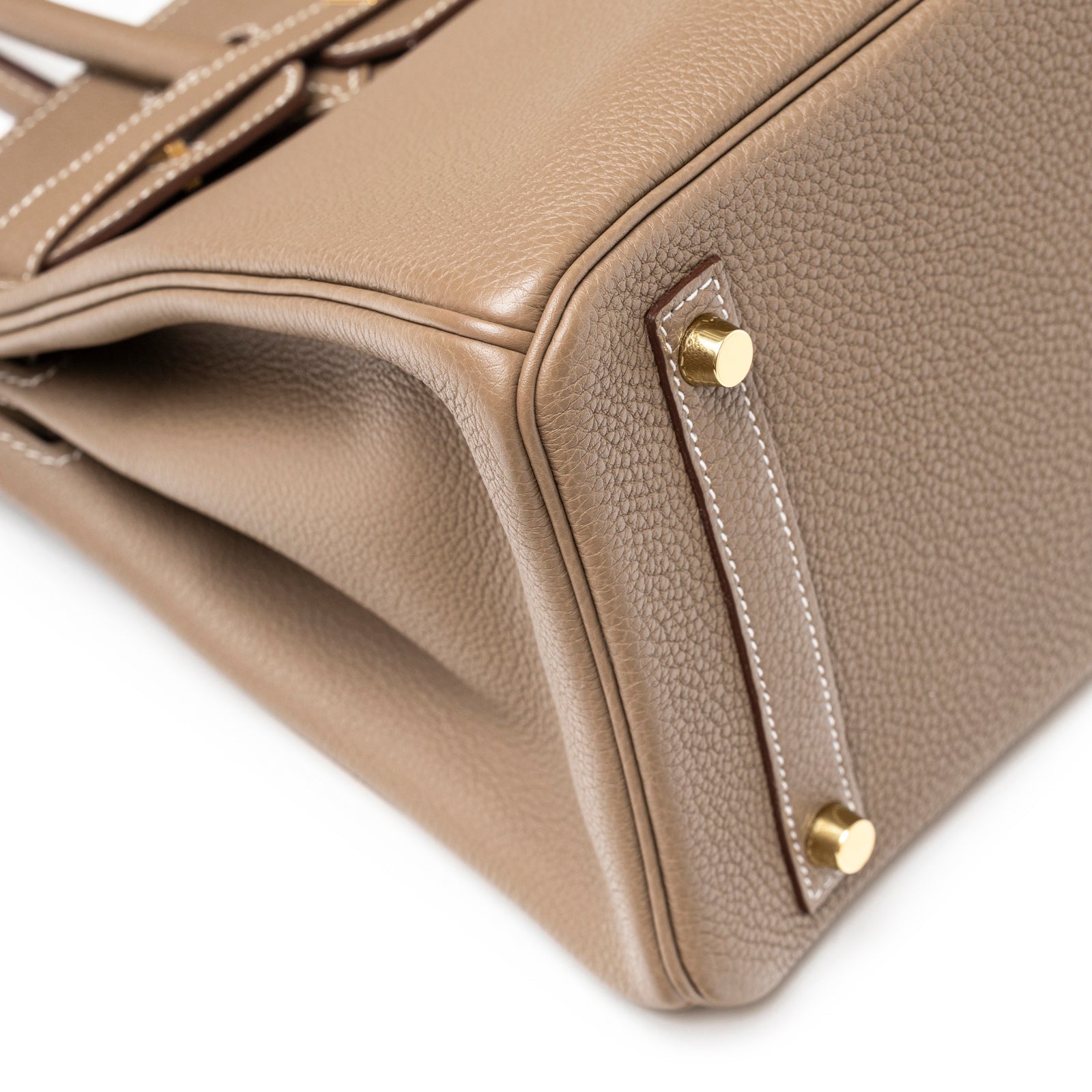 Close-up angled shot of Hermès Birkin 30 Etoupe Togo Gold Hardware showing textured leather and gold feet details
