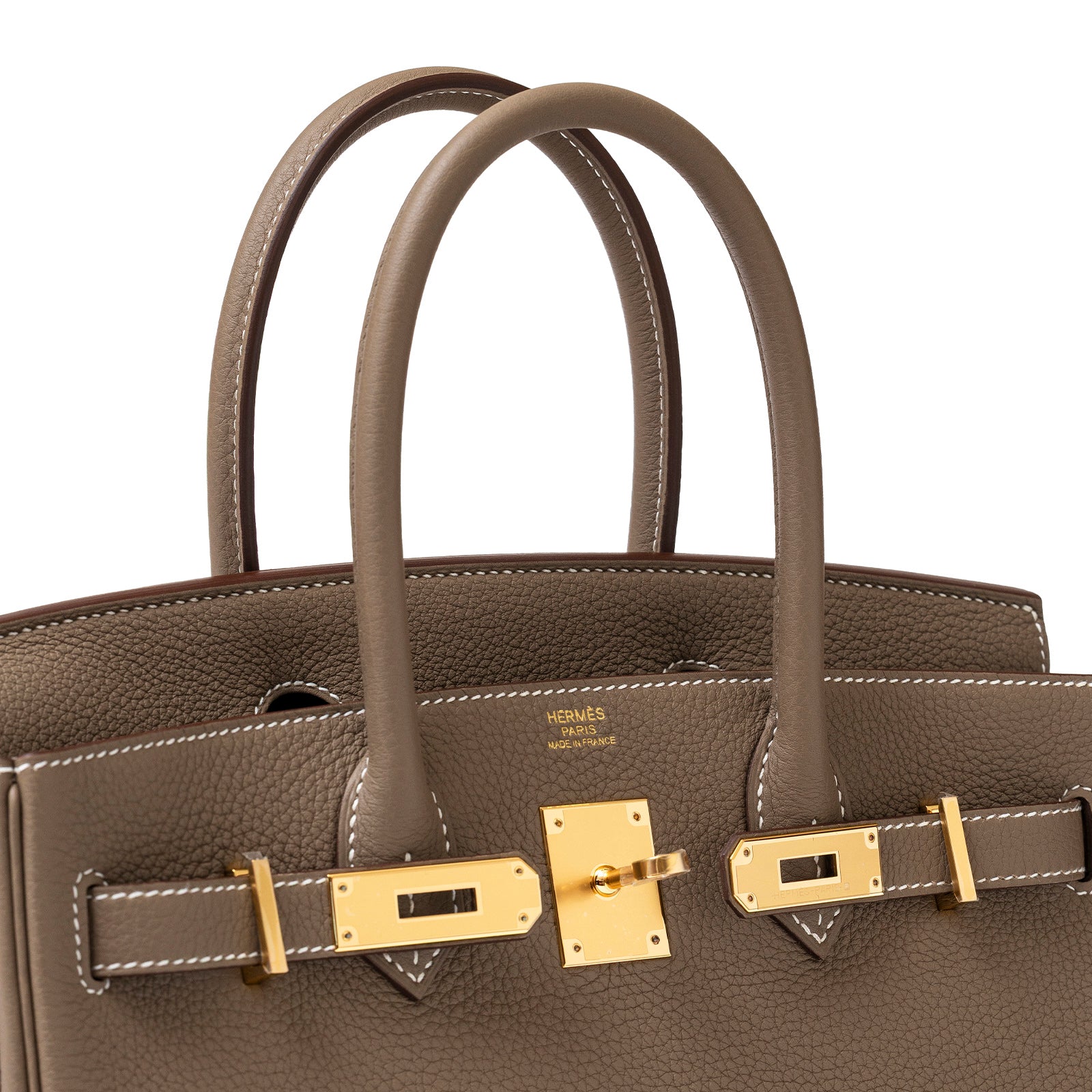 Close-up angled view of Hermès Birkin 30 Etoupe Togo Gold Hardware showing top handles and clasp details