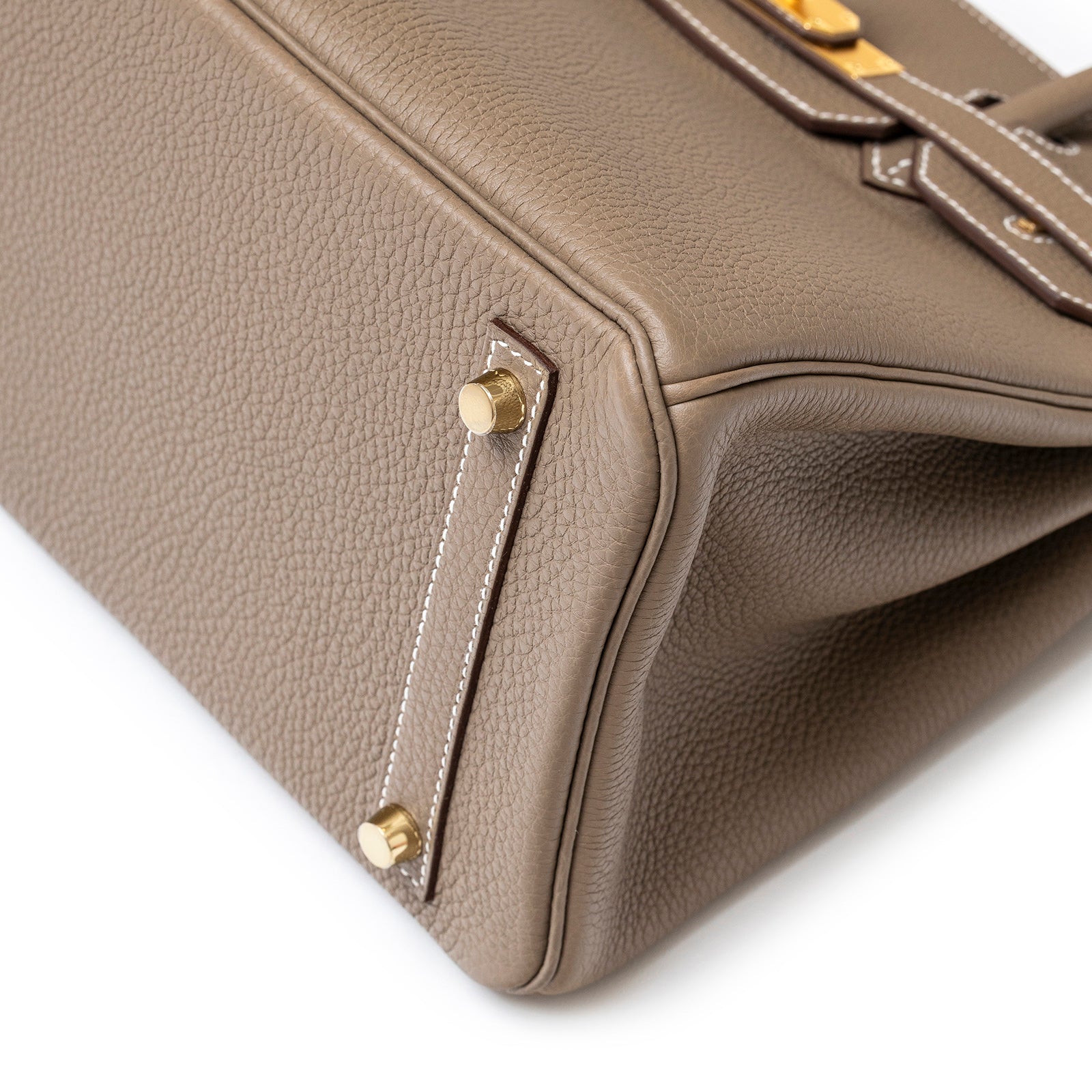 Close-up of the bottom corner showing gold hardware and Etoupe Togo leather on Hermès Birkin 30 Etoupe Togo Gold Hardware