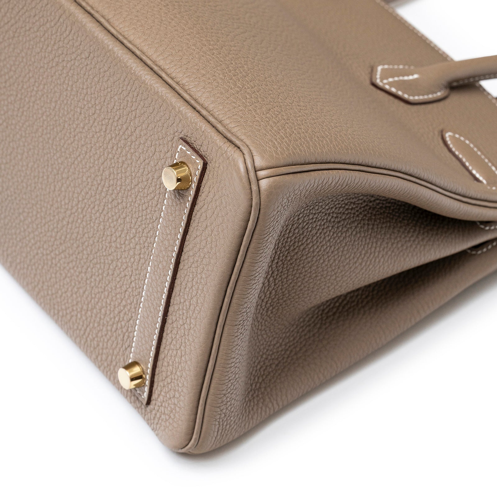 Close-up of bottom corner and gold hardware on Hermès Birkin 30 Etoupe Togo Gold Hardware tote bag