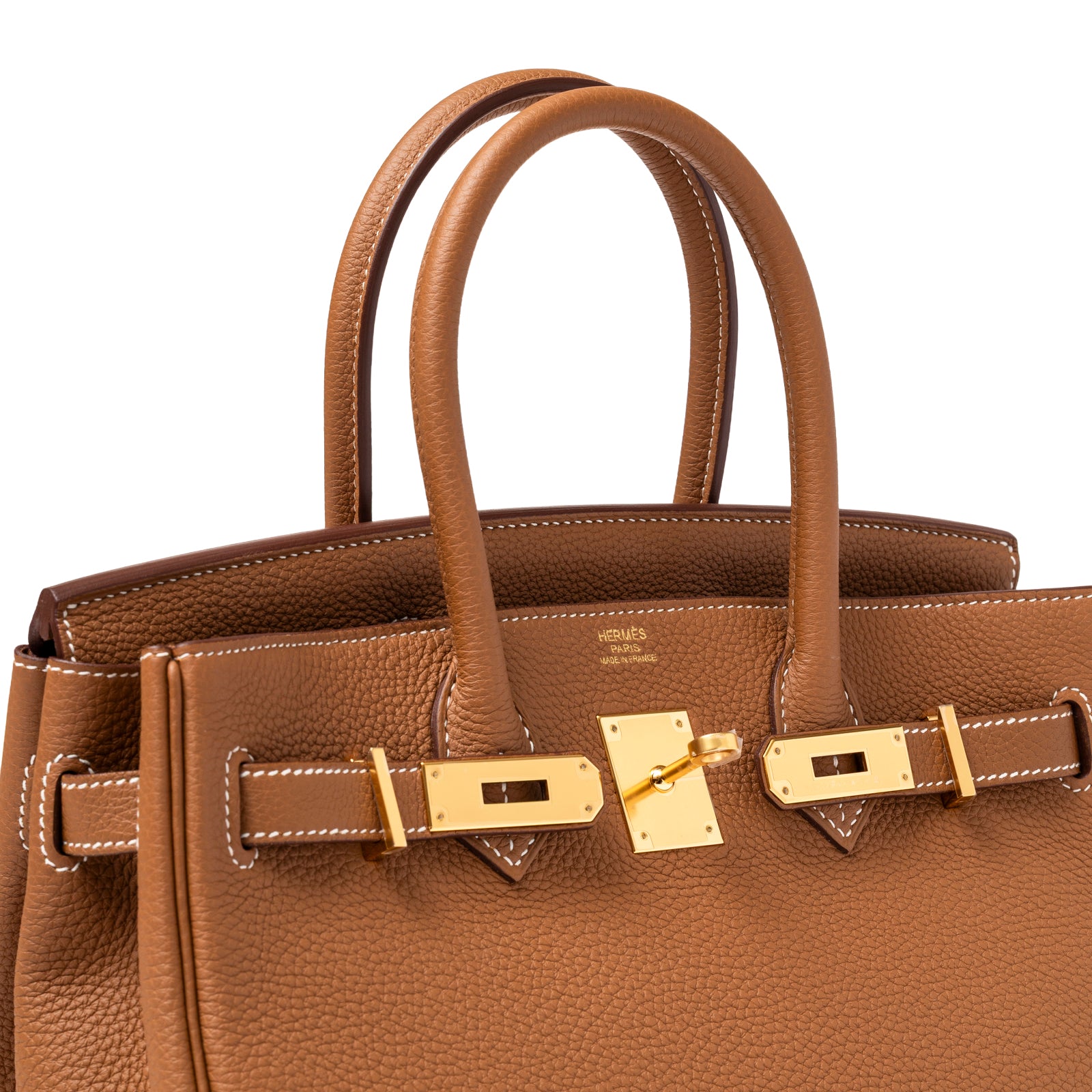 Close-up of Hermès Birkin 30 Gold Togo Gold Hardware showing textured leather and polished gold clasp details.