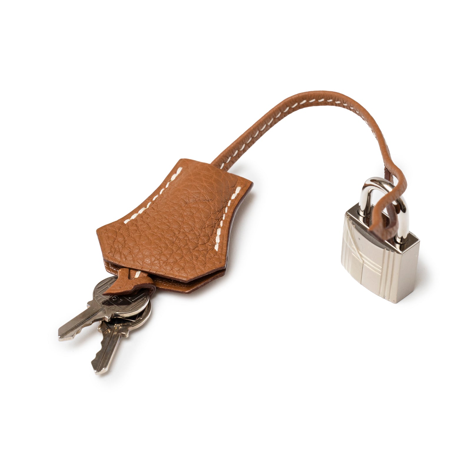 Close-up of Hermès Birkin 30 Gold Togo Palladium Hardware leather key holder with attached keys and lock detail.