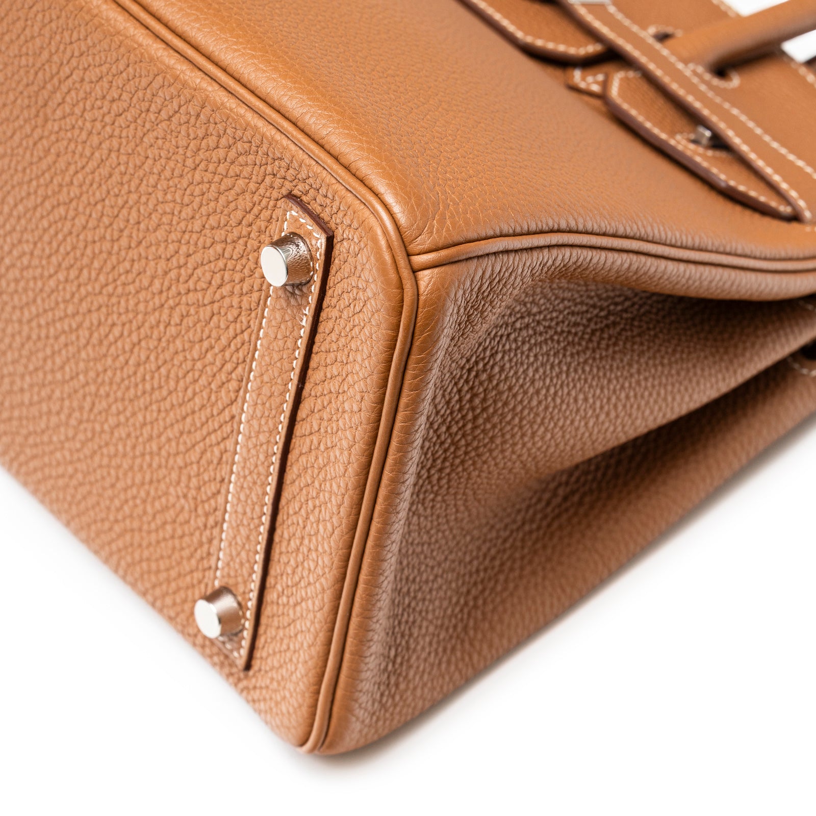Close-up of the base showing detailed gold togo leather texture and palladium hardware on Hermès Birkin 30 Gold Togo Palladium Hardware
