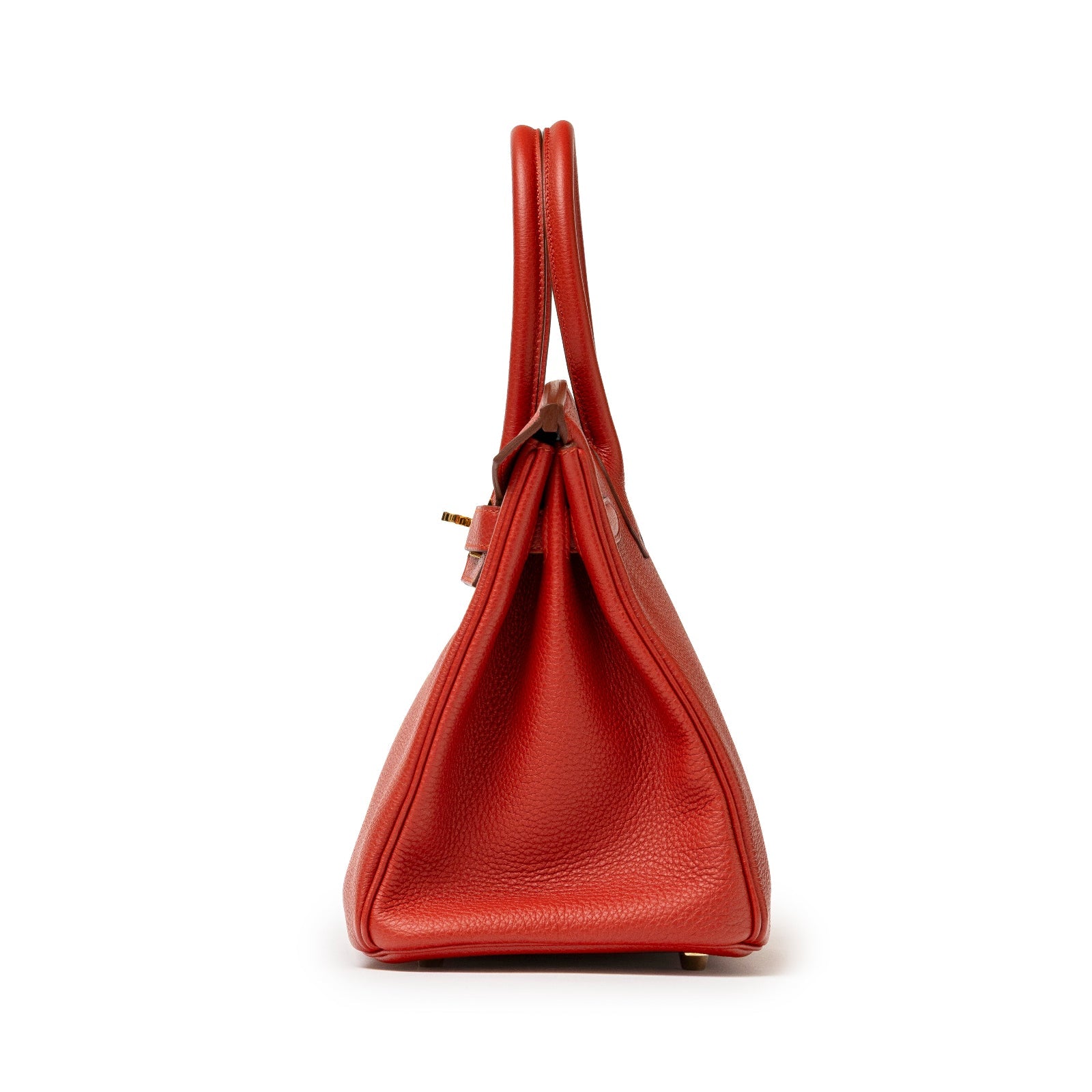 Side view of Hermès Birkin 30 Rouge Togo with gold hardware showing textured leather and handle drop.