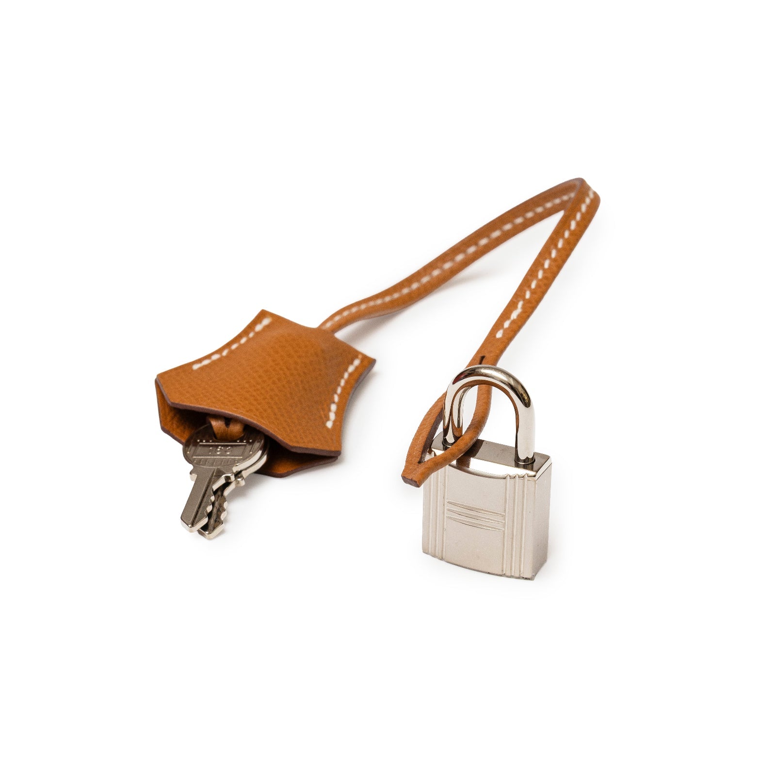 Close-up of Hermès Birkin 30 Sellier Gold Epsom Palladium Hardware lock and leather clochette